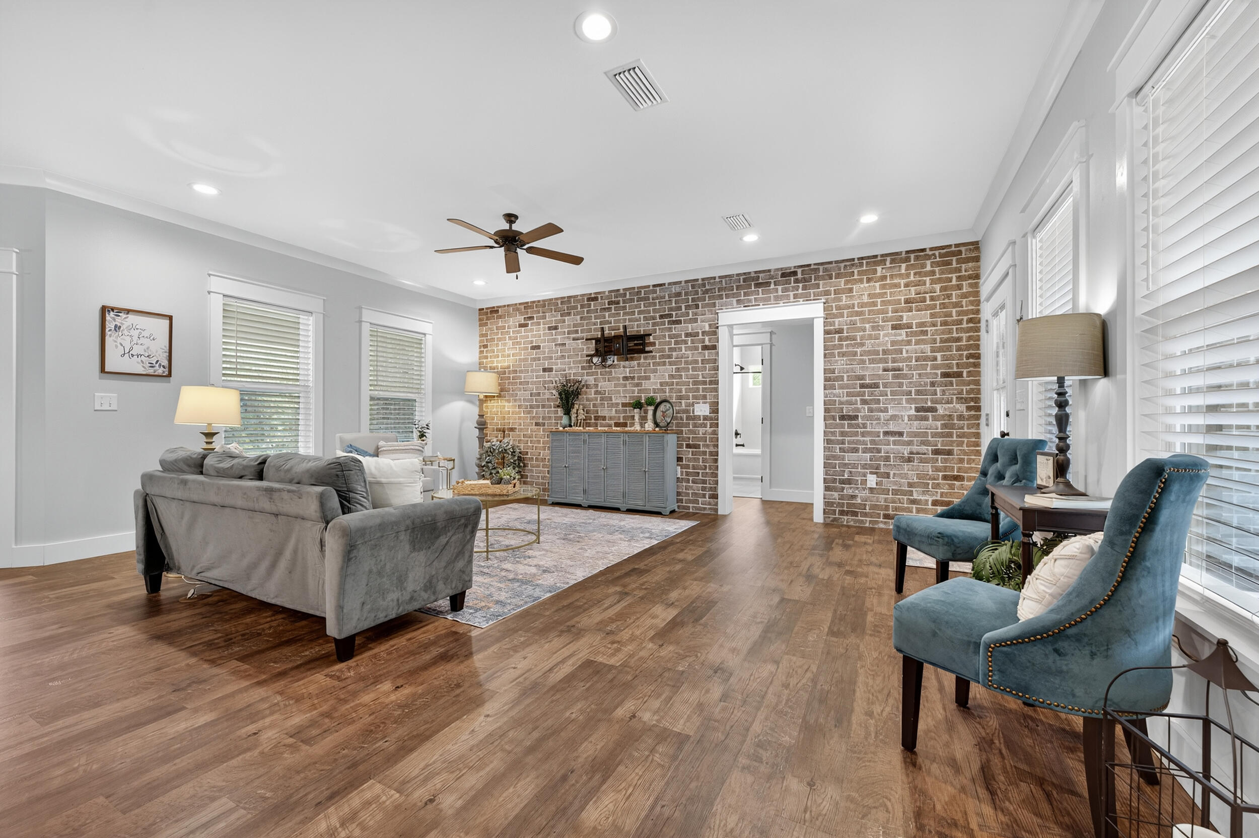 768 Long Road DeFuniak Springs, FL 32433 - Photo 12 of 106 a living room with furniture and a wooden floor