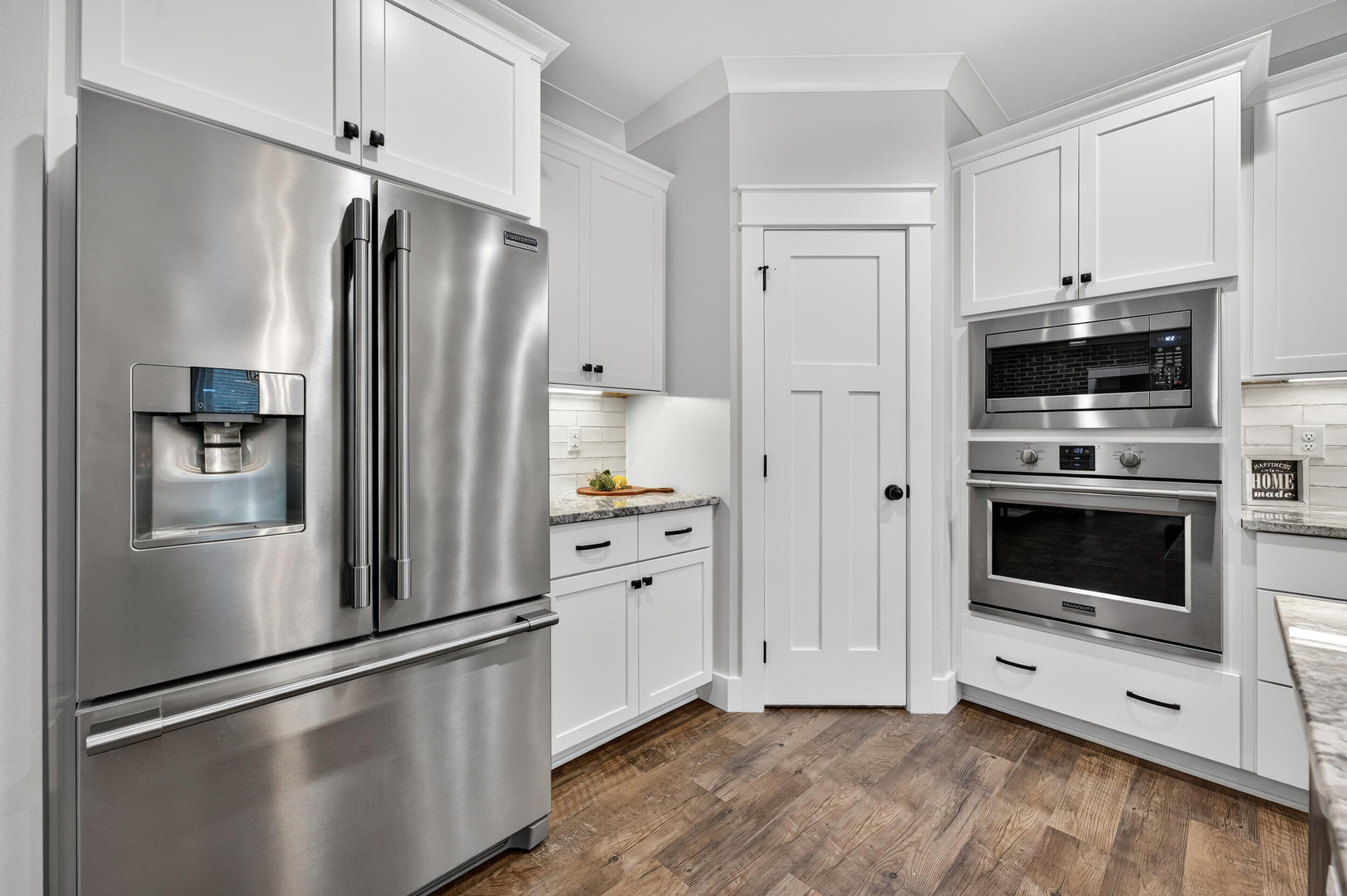 768 Long Road DeFuniak Springs, FL 32433 - Photo 18 of 106 a kitchen with stainless steel appliances a refrigerator stove and microwave