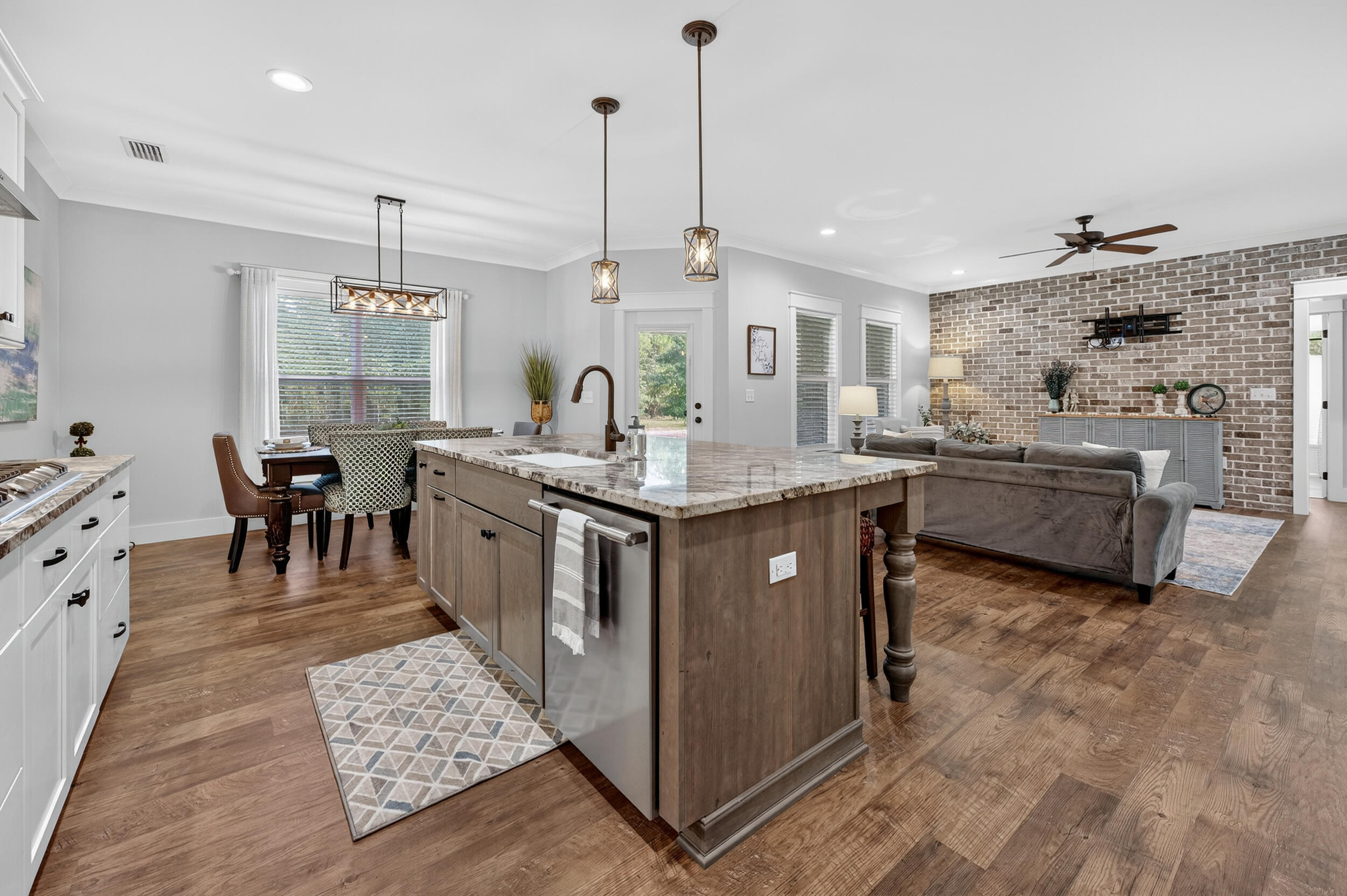 768 Long Road DeFuniak Springs, FL 32433 - Photo 20 of 106 a kitchen with granite countertop a sink a counter top space appliances and cabinets