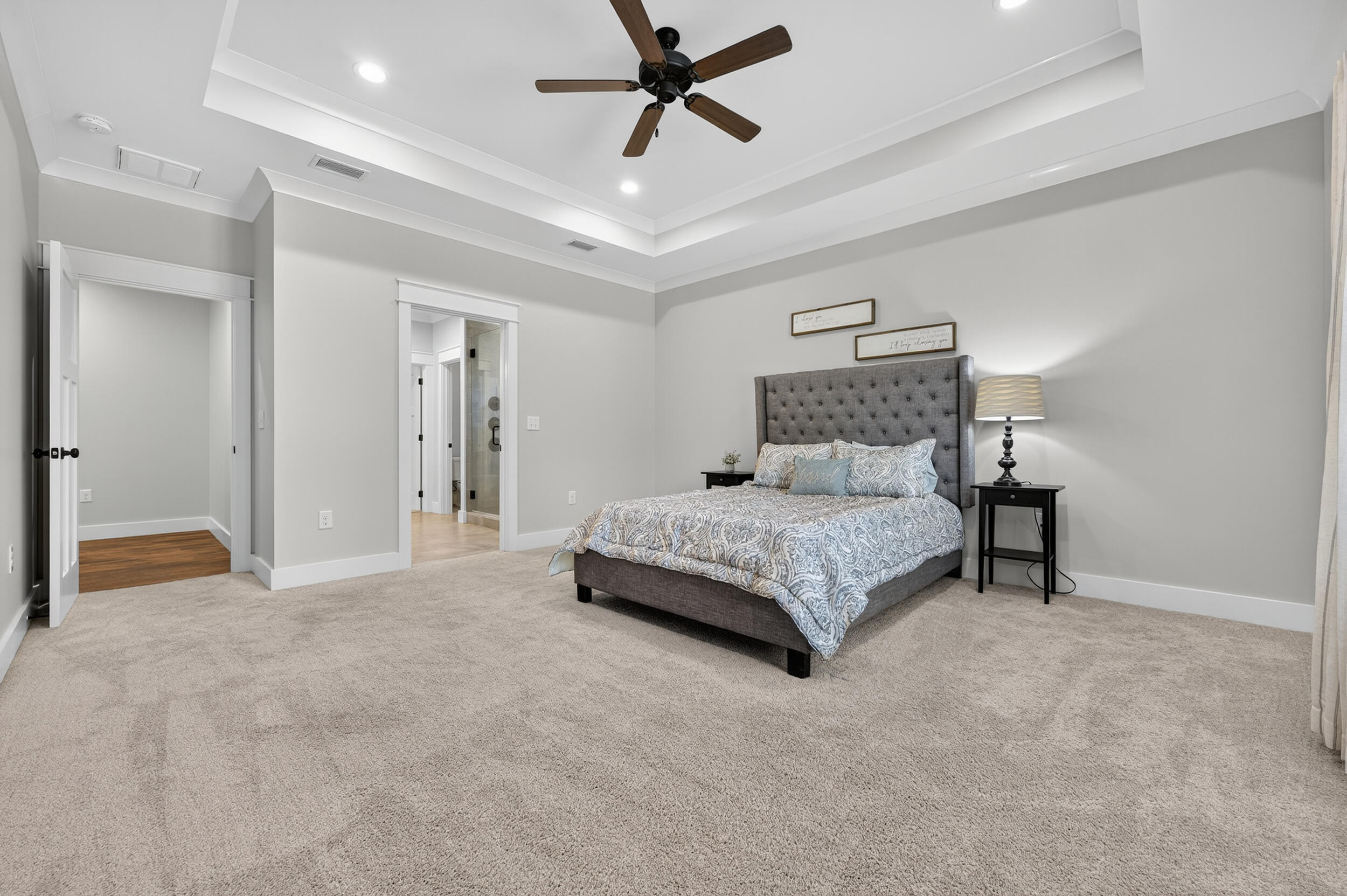 768 Long Road DeFuniak Springs, FL 32433 - Photo 32 of 106 a bedroom with a bed and a chandelier