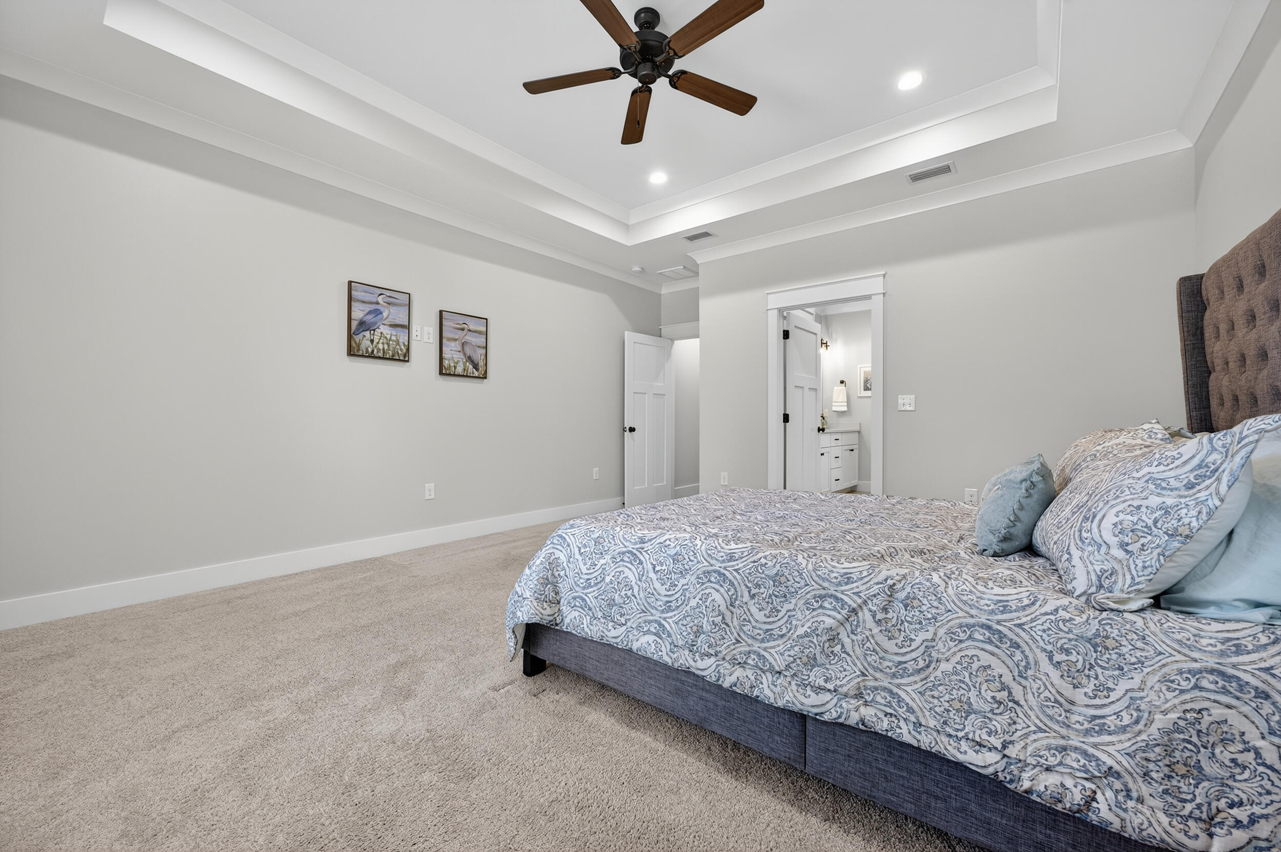 768 Long Road DeFuniak Springs, FL 32433 - Photo 33 of 106 a bedroom with a large bed and ceiling fan