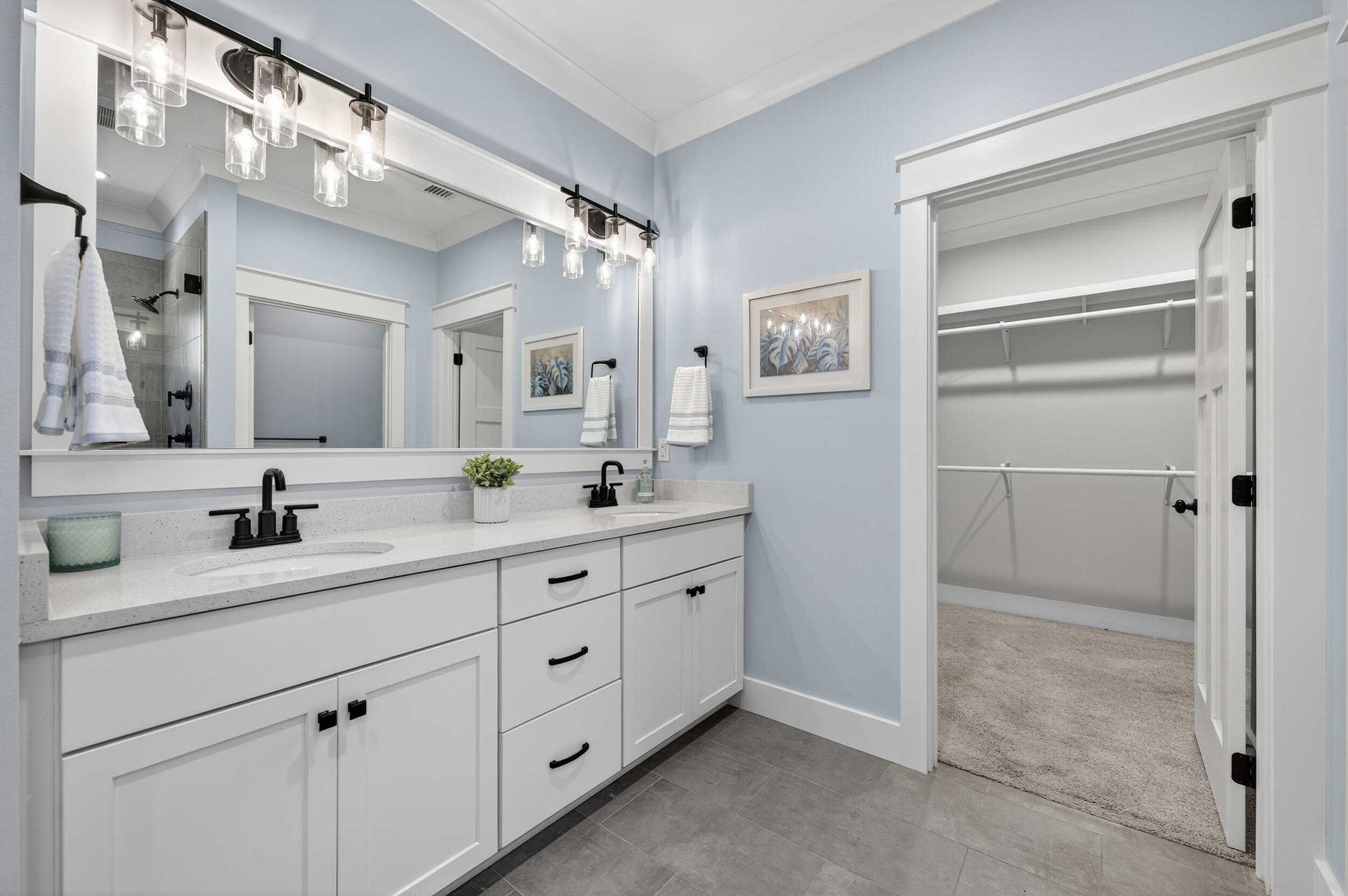 768 Long Road DeFuniak Springs, FL 32433 - Photo 36 of 106 a bathroom with a double vanity sink mirror and