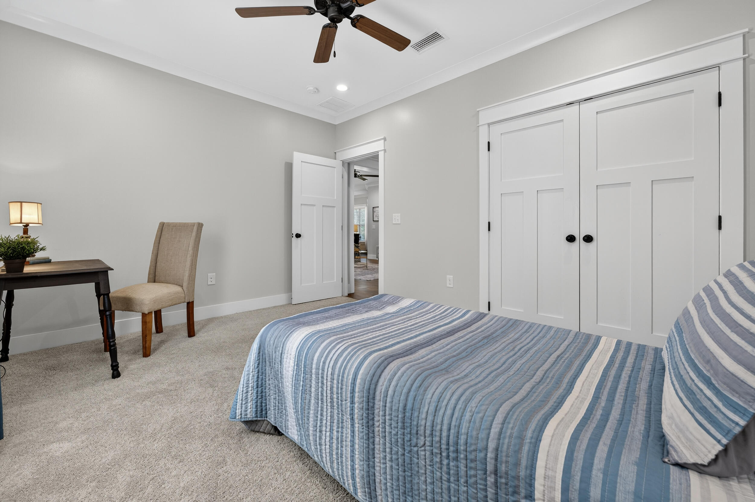 768 Long Road DeFuniak Springs, FL 32433 - Photo 47 of 106 a bedroom with a bed a chair and a chandelier