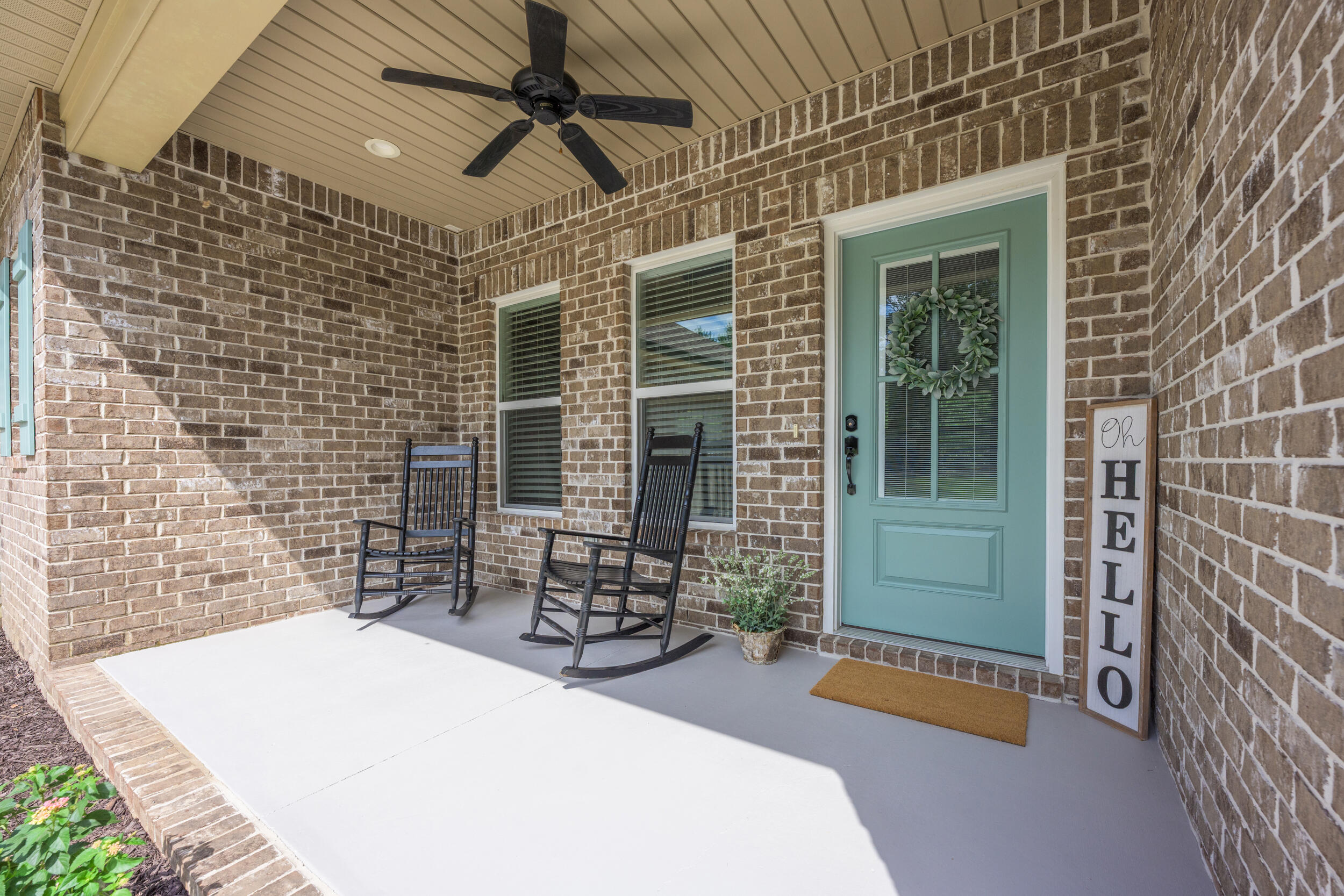 768 Long Road DeFuniak Springs, FL 32433 - Photo 5 of 106 a patio with table and chairs and potted plants