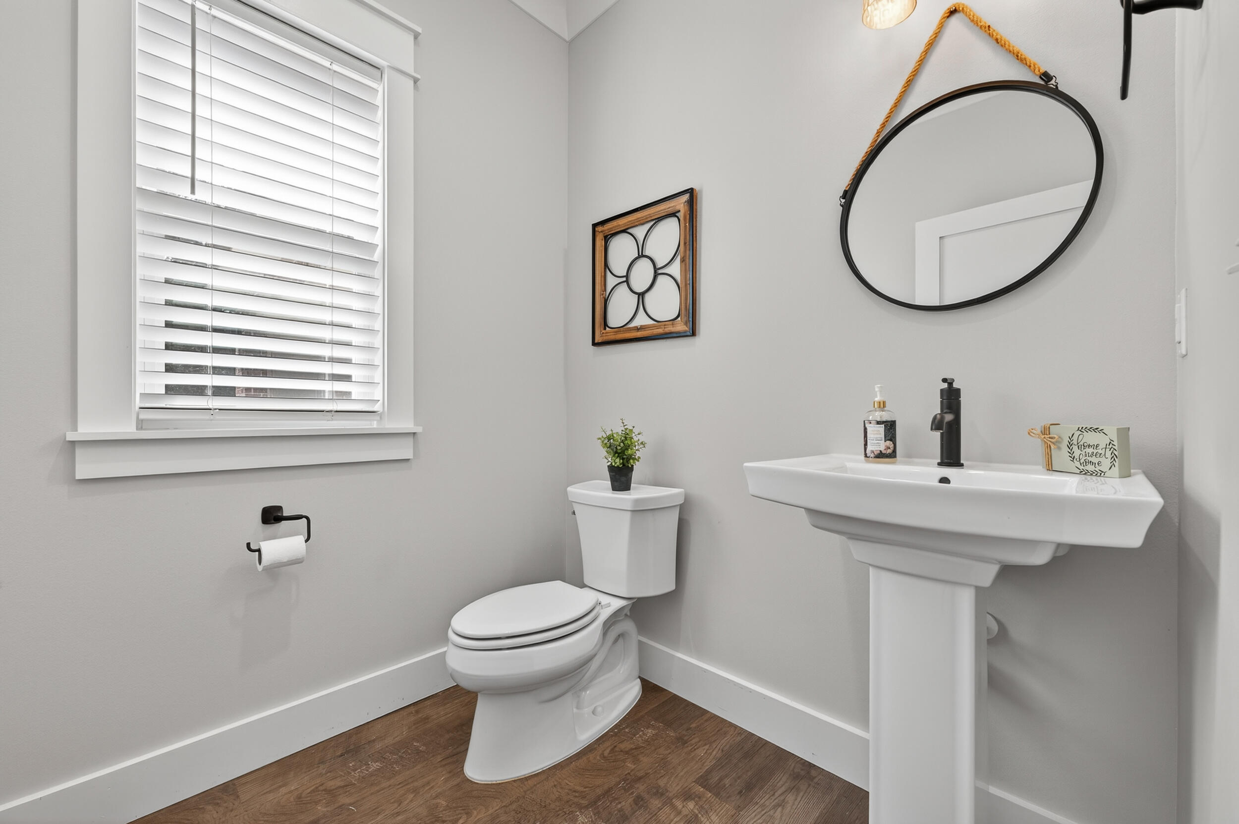 768 Long Road DeFuniak Springs, FL 32433 - Photo 54 of 106 a bathroom with a toilet a sink and a mirror
