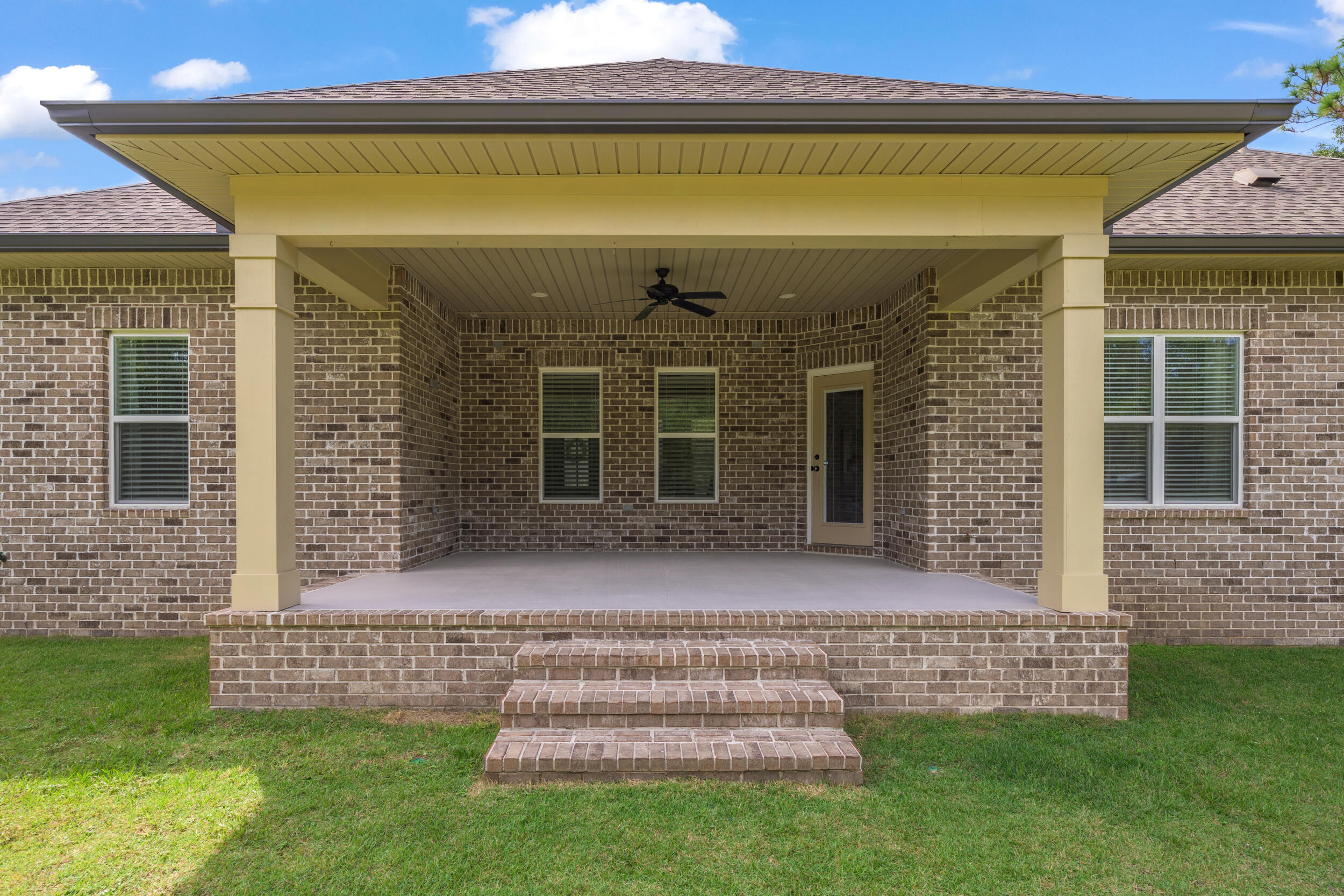 768 Long Road DeFuniak Springs, FL 32433 - Photo 58 of 106 a front view of a house with a garden