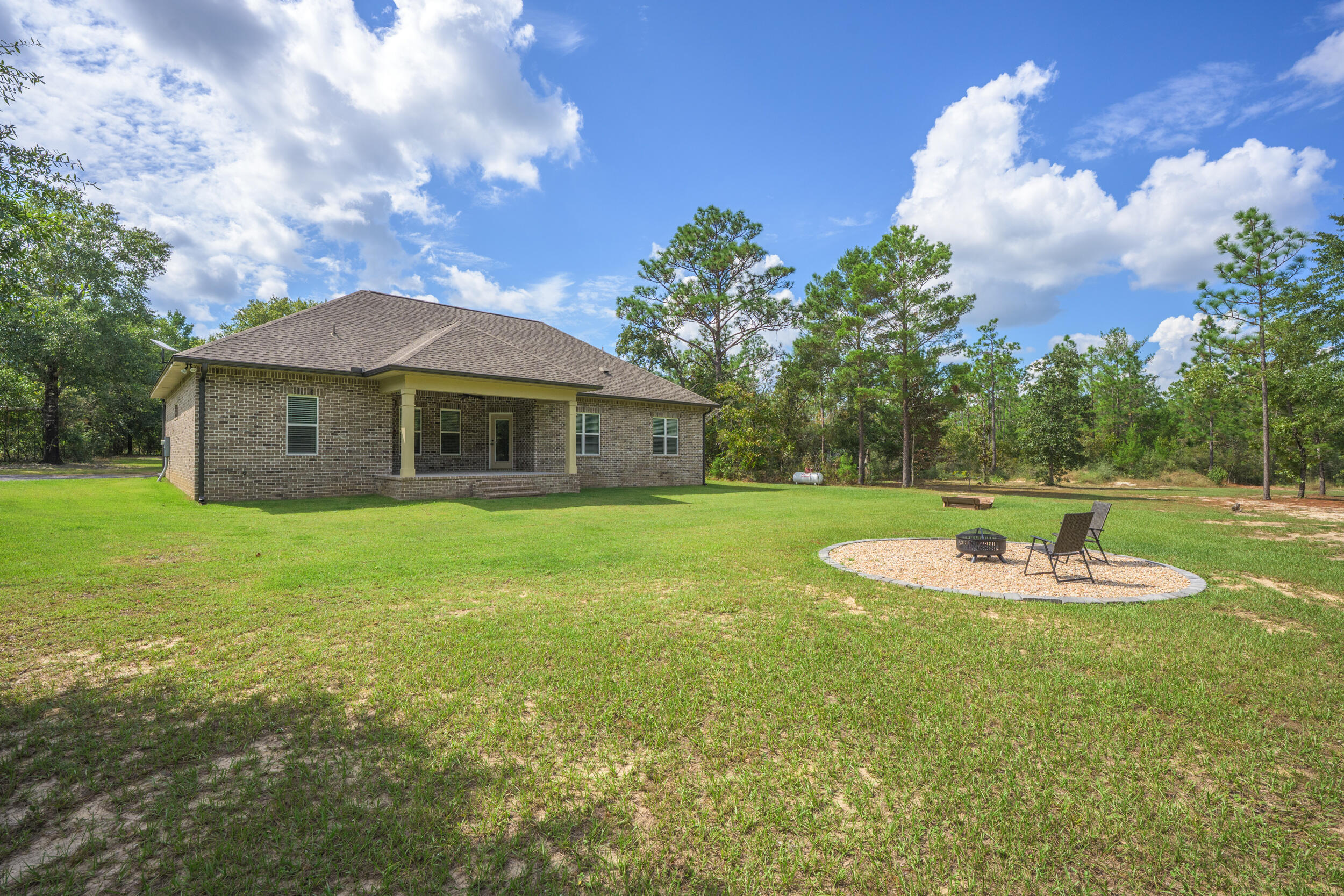 768 Long Road DeFuniak Springs, FL 32433 - Photo 60 of 106 a view of a house with a yard