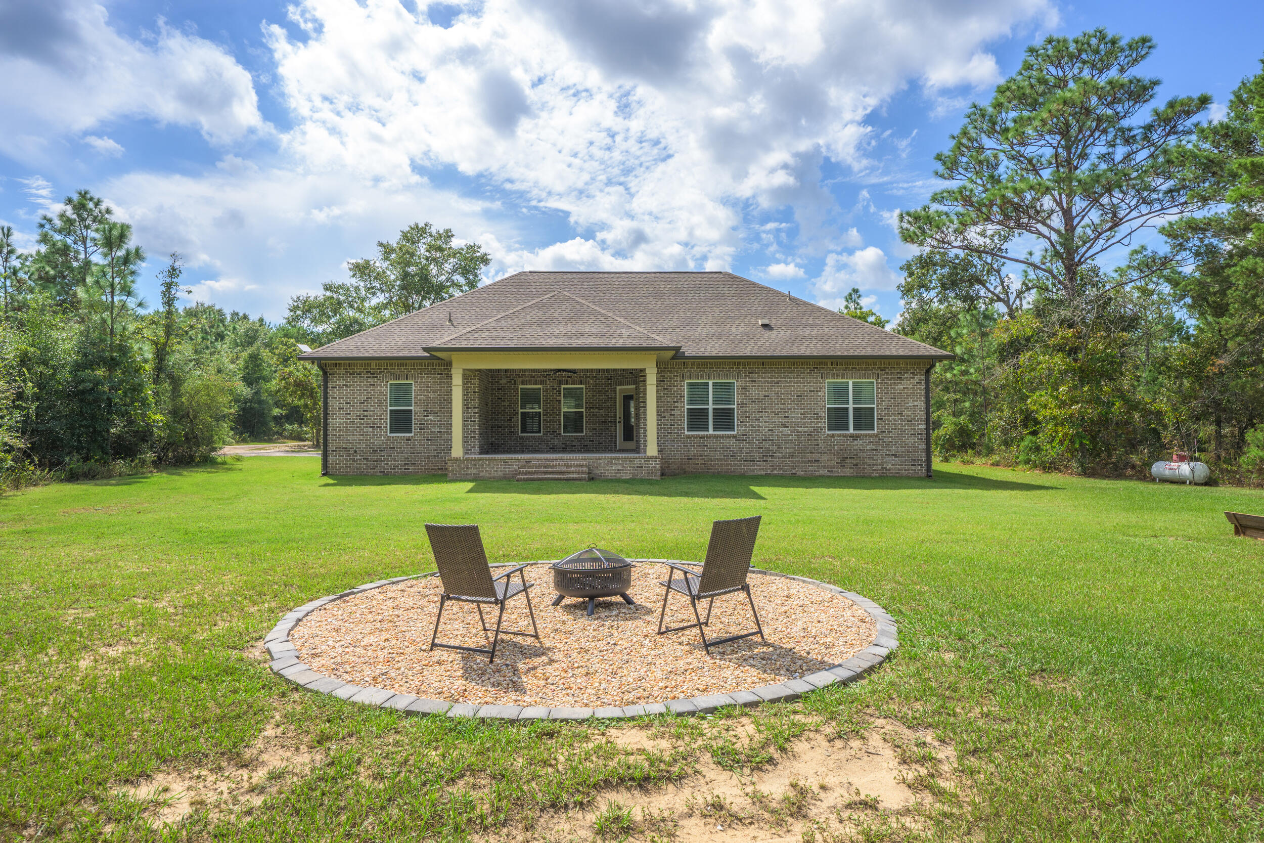 768 Long Road DeFuniak Springs, FL 32433 - Photo 61 of 106 a backyard of a house with table and chairs