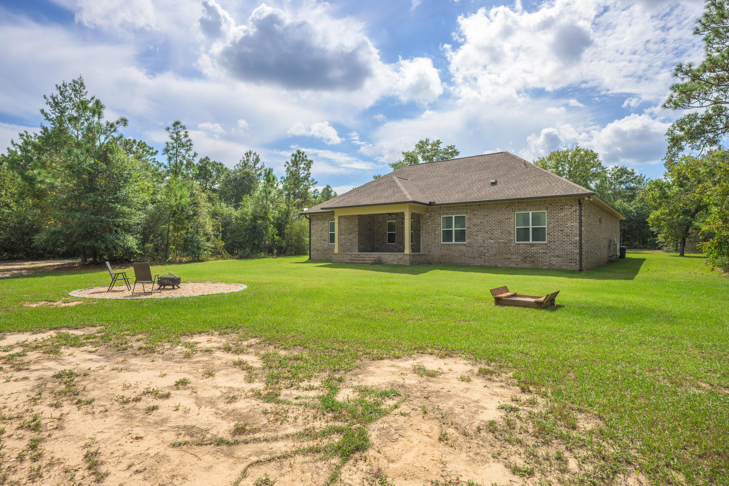 768 Long Road DeFuniak Springs, FL 32433 - Photo 62 of 106 a view of a house with a backyard
