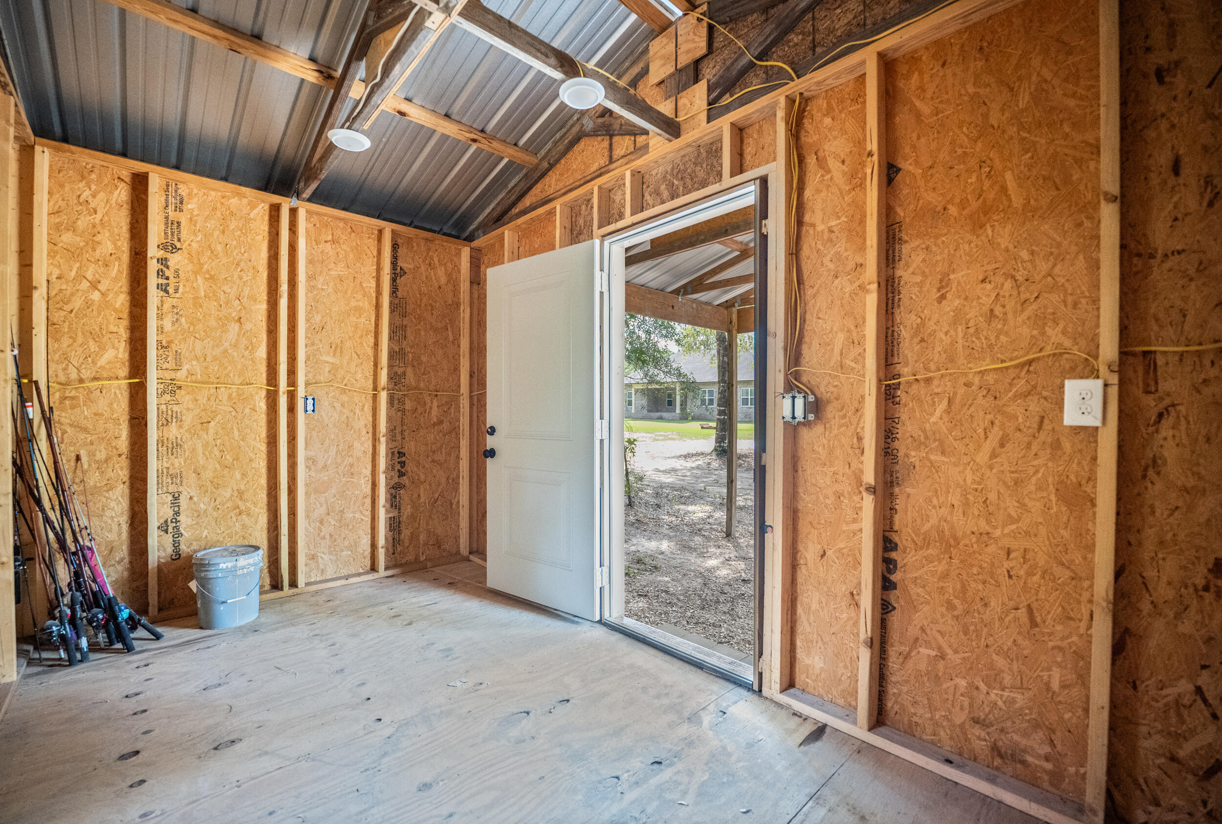 768 Long Road DeFuniak Springs, FL 32433 - Photo 70 of 106 a view of a room with wooden floor and windows