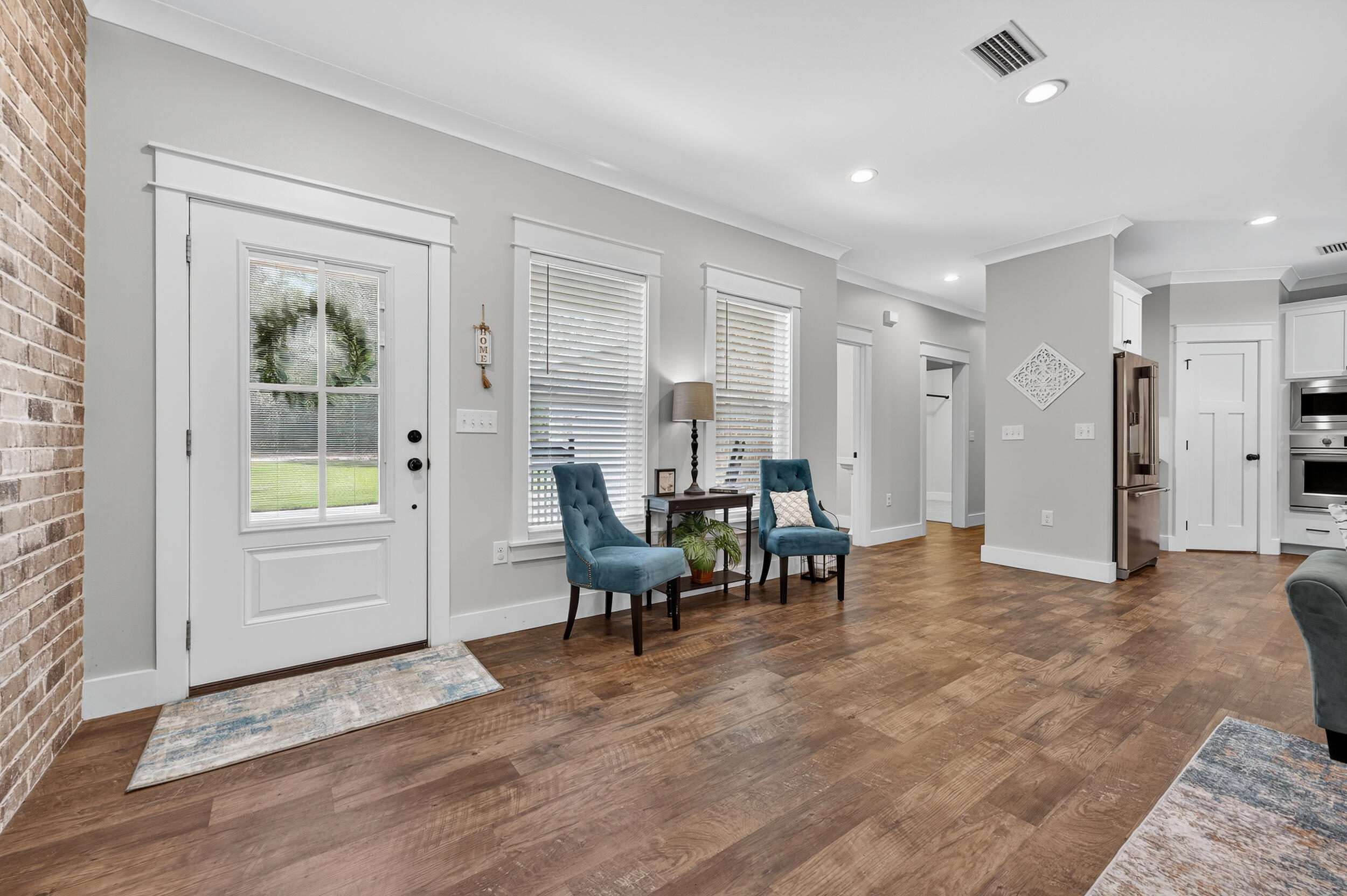 768 Long Road DeFuniak Springs, FL 32433 - Photo 8 of 106 a living room with furniture and a wooden floor
