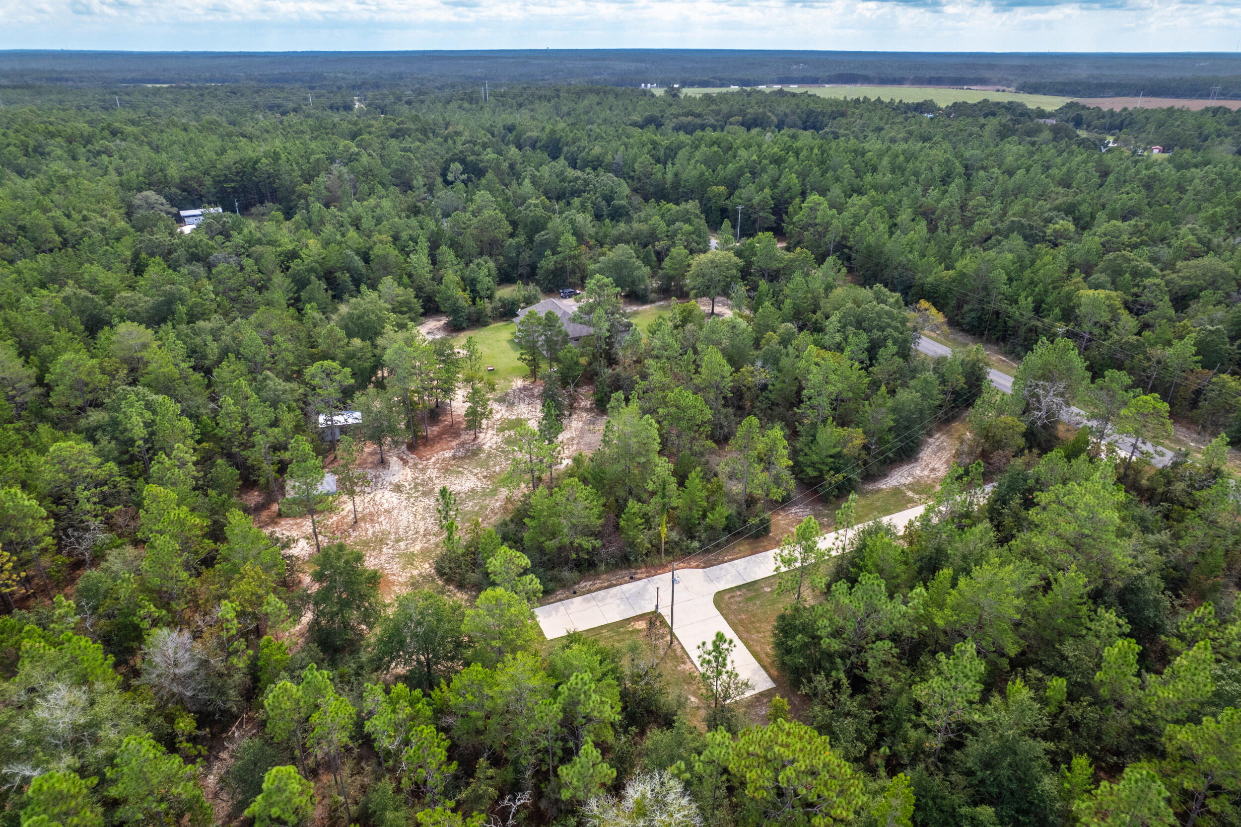 768 Long Road DeFuniak Springs, FL 32433 - Photo 90 of 106 an aerial view of a house with a yard