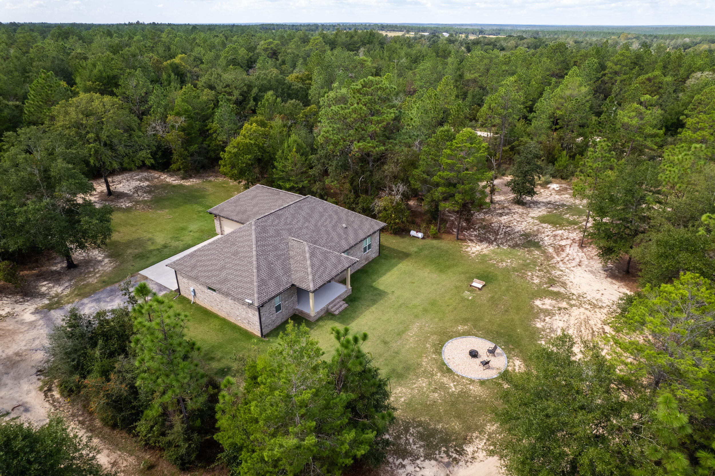 768 Long Road DeFuniak Springs, FL 32433 - Photo 94 of 106 a view of a house with a yard