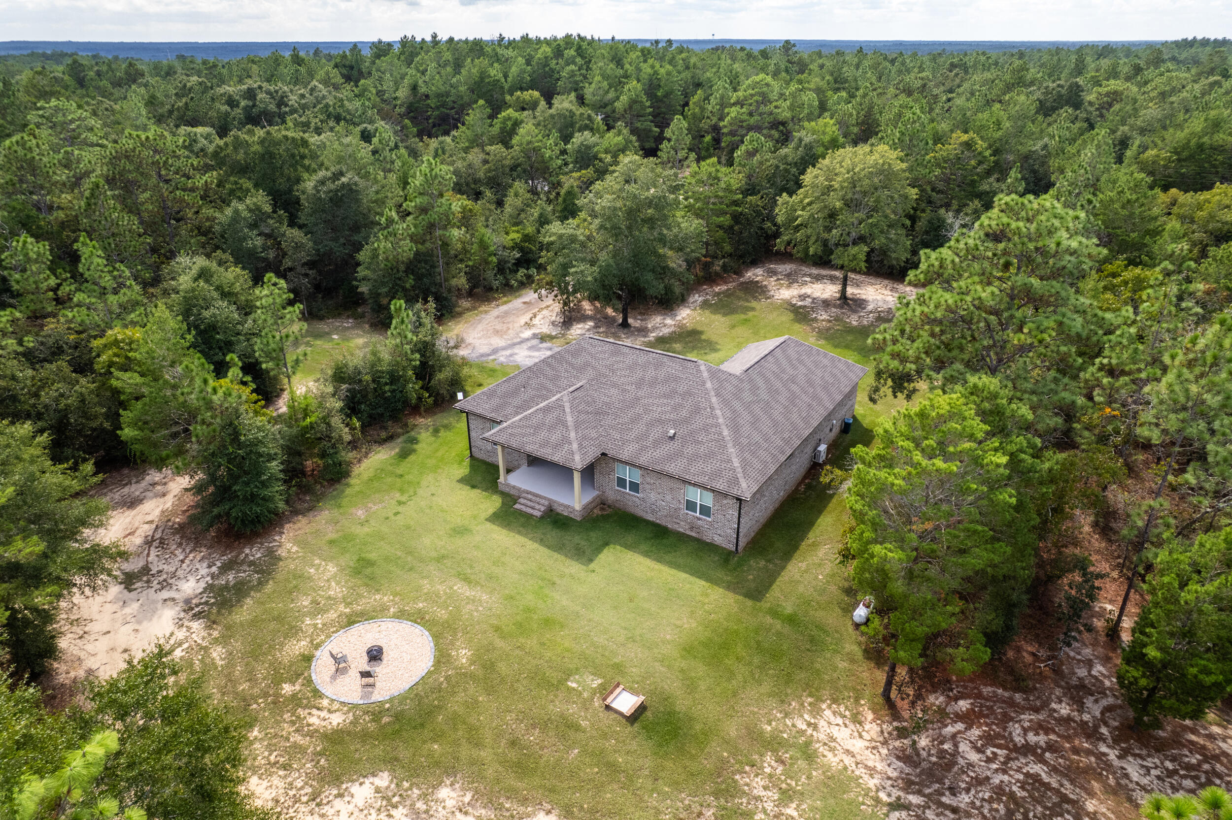 768 Long Road DeFuniak Springs, FL 32433 - Photo 96 of 106 a view of a house with a yard