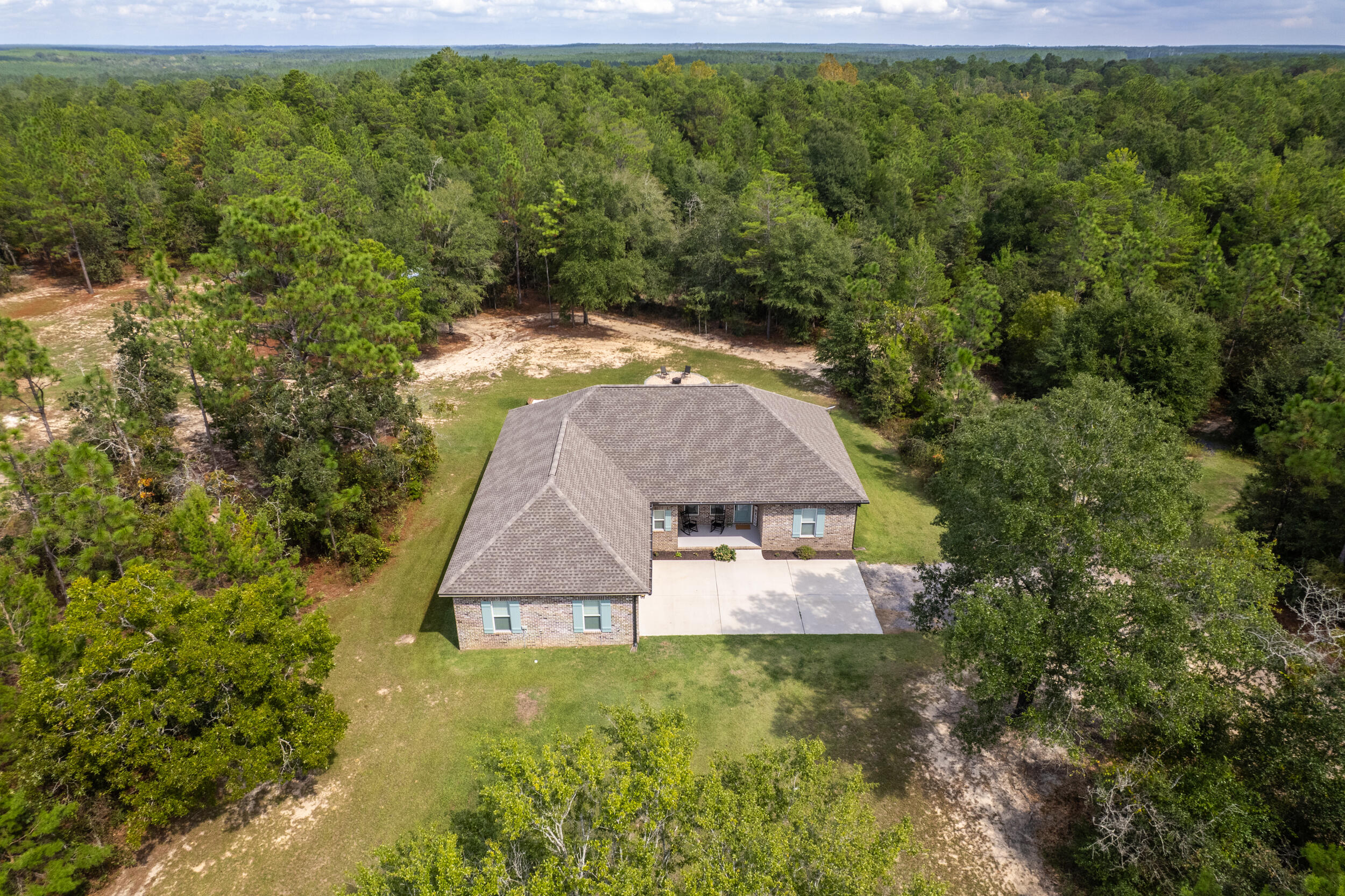 768 Long Road DeFuniak Springs, FL 32433 - Photo 98 of 106 a aerial view of a house with garden