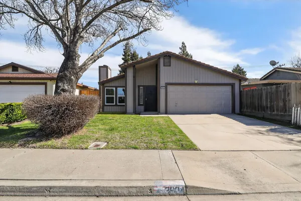 front view of a house with a yard