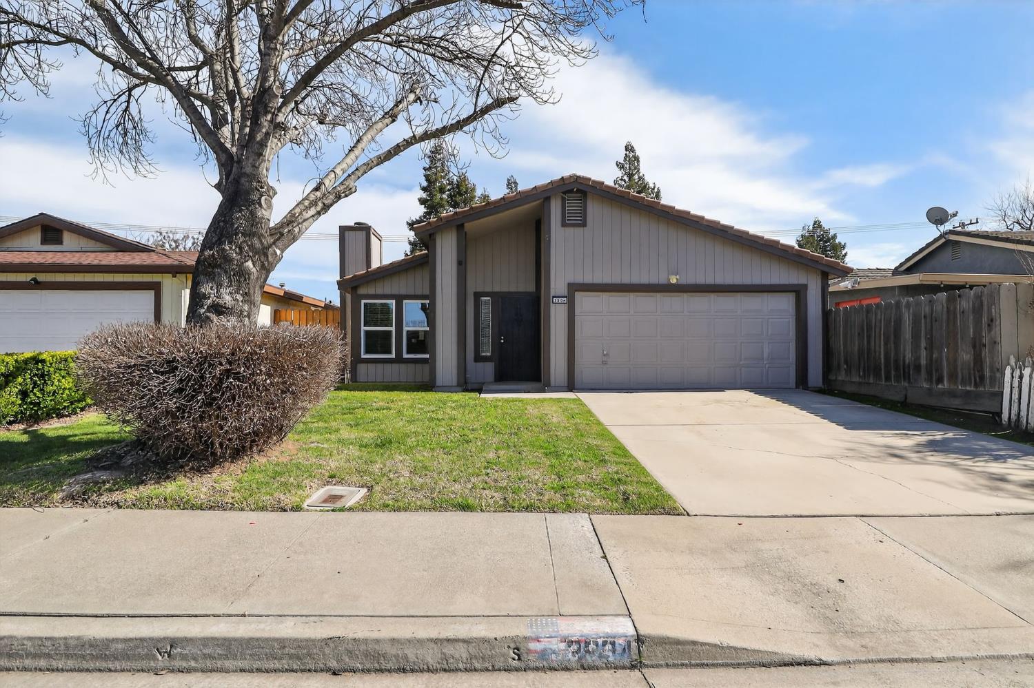 front view of a house with a yard
