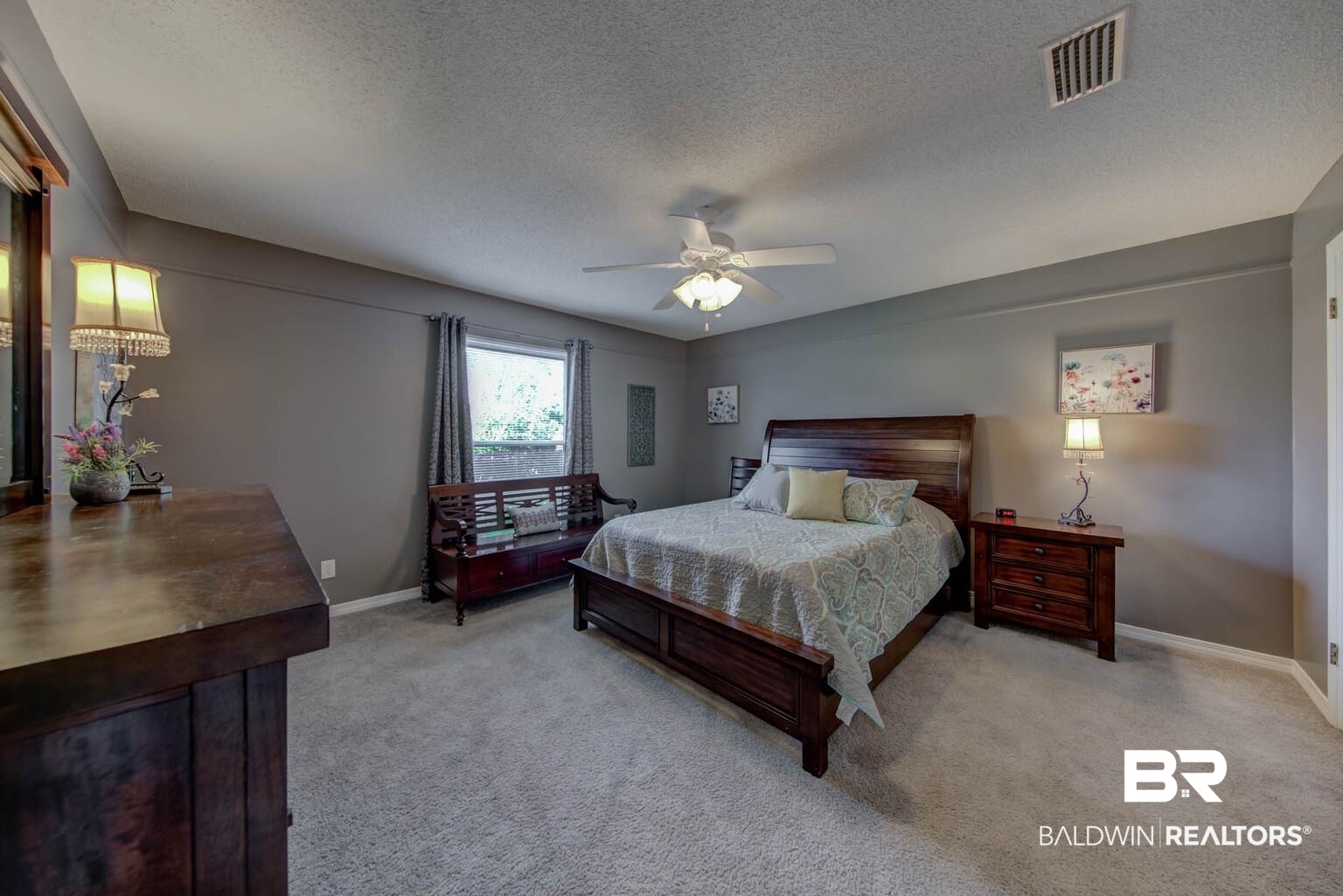 304 West Palm Avenue Foley, AL 36535 - Photo 8 of 18 Bedroom featuring ceiling fan, a textured ceiling, and light carpet