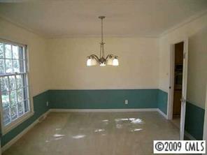5301 Providence Road Charlotte, NC 28226 - Photo 7 of 8 a room with a window and a chandelier