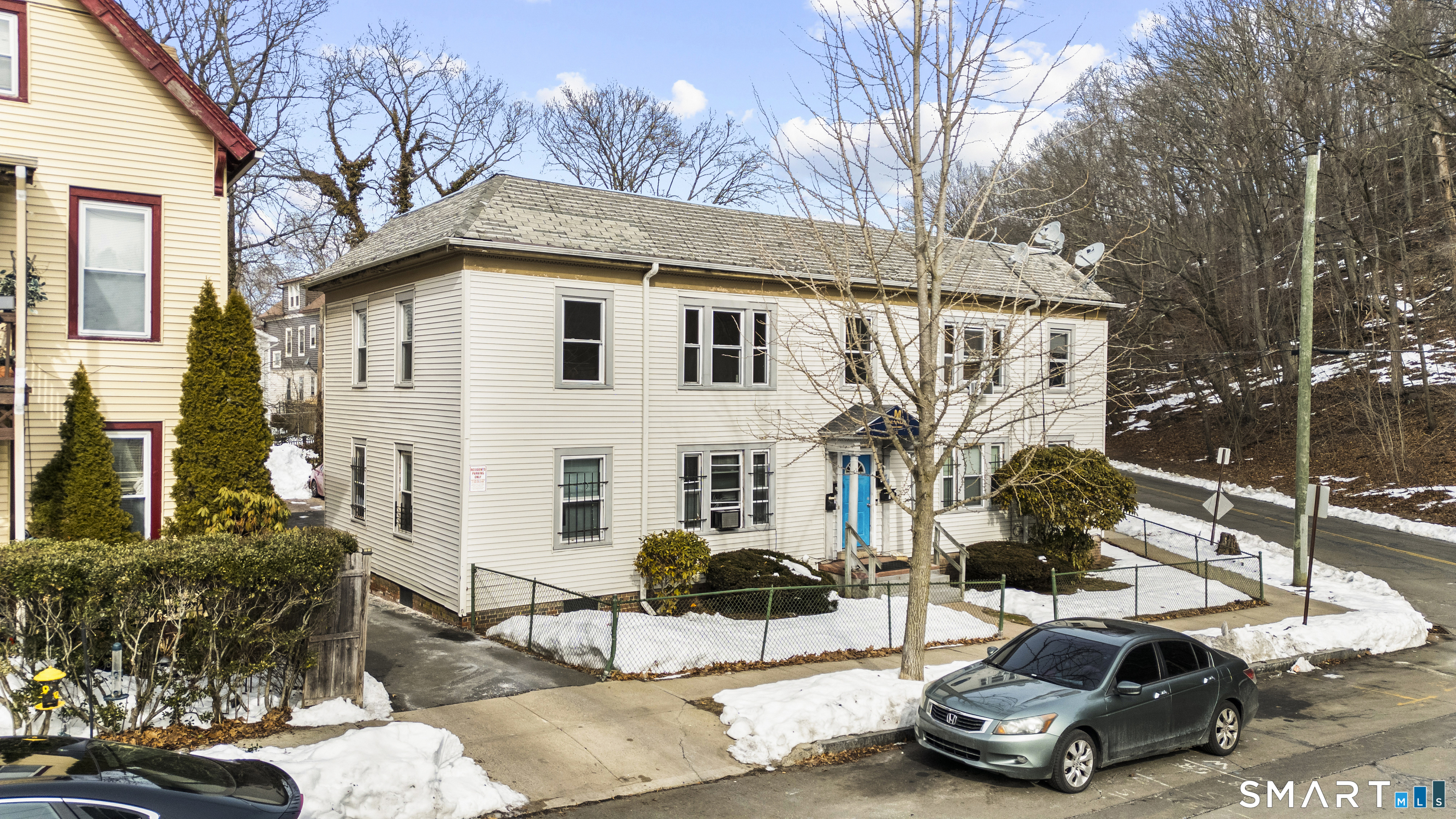 76 Ridge Street New Haven, CT 06511 - Photo 18 of 19 a view of a white house with a yard