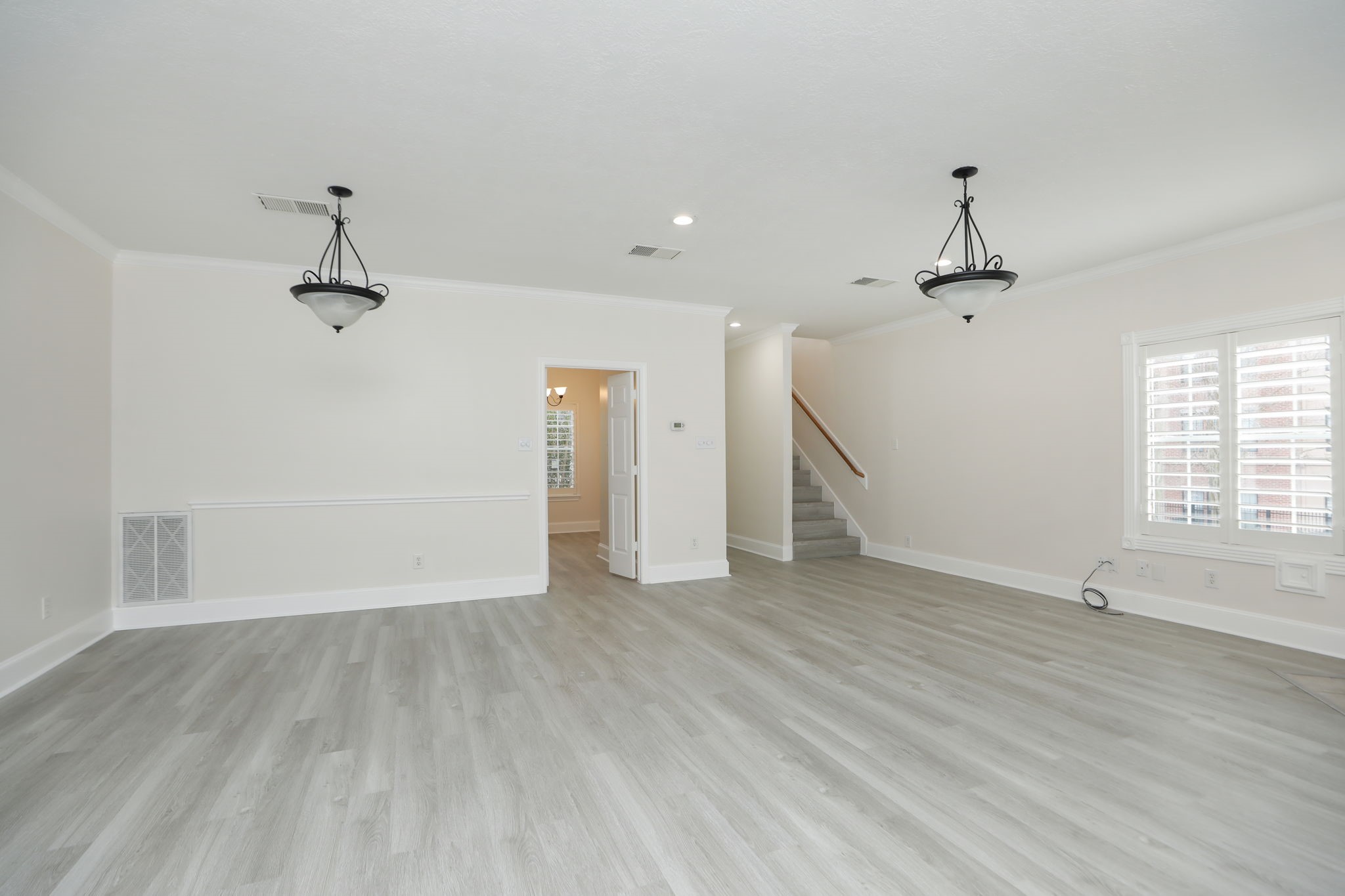 1893 Ewing Street Houston, TX 77004 - Photo 15 of 39 wooden floor in an empty room with a window
