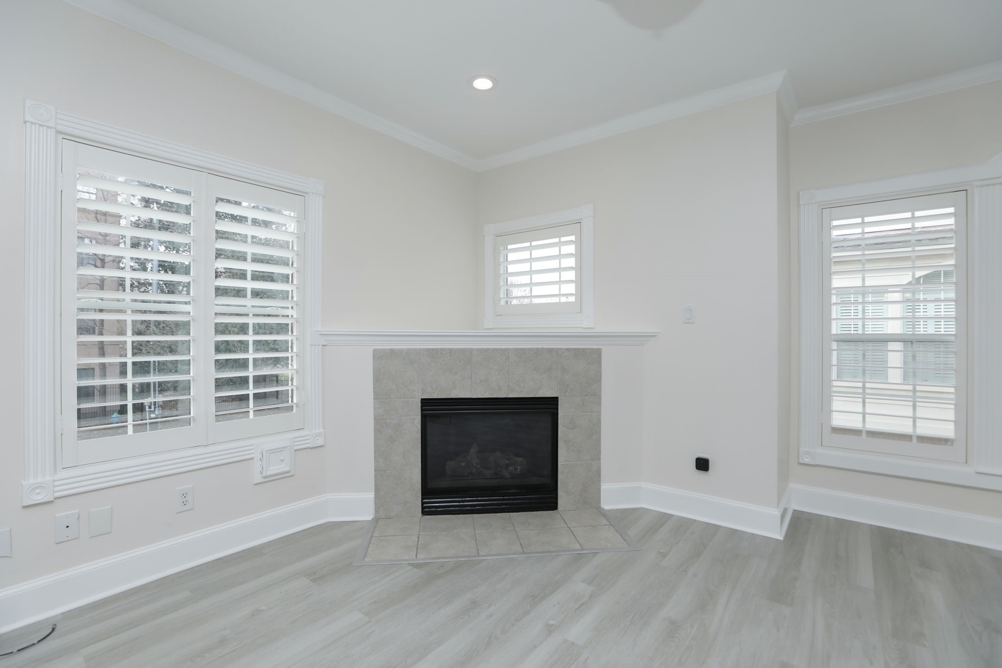 1893 Ewing Street Houston, TX 77004 - Photo 16 of 39 a view of an empty room with wooden floor and a window