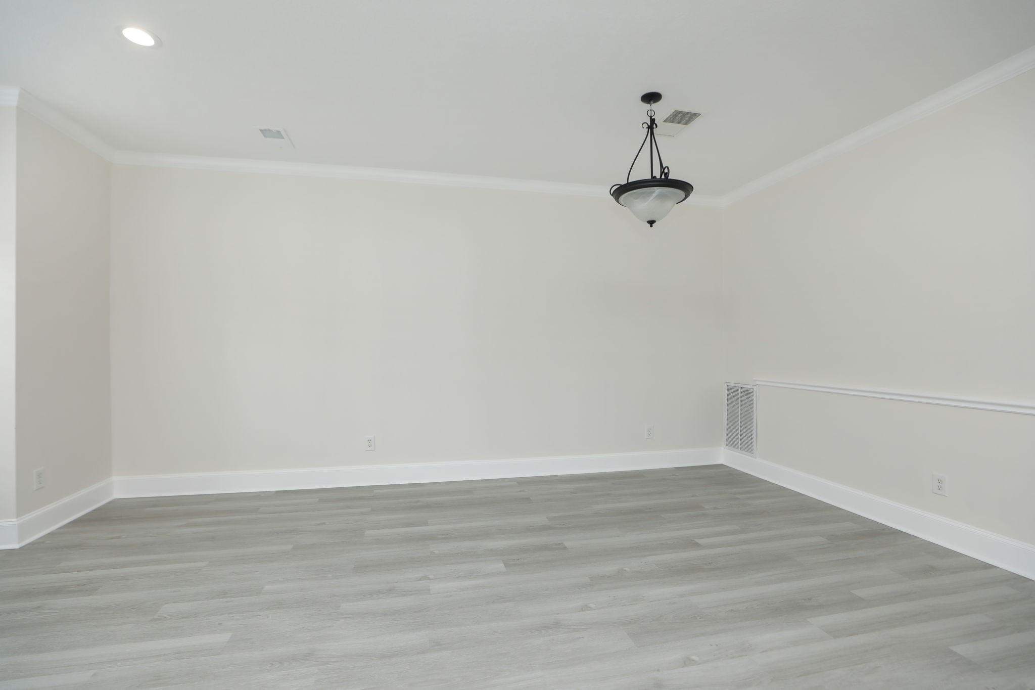 1893 Ewing Street Houston, TX 77004 - Photo 17 of 39 a view of a room with wooden floor and windows