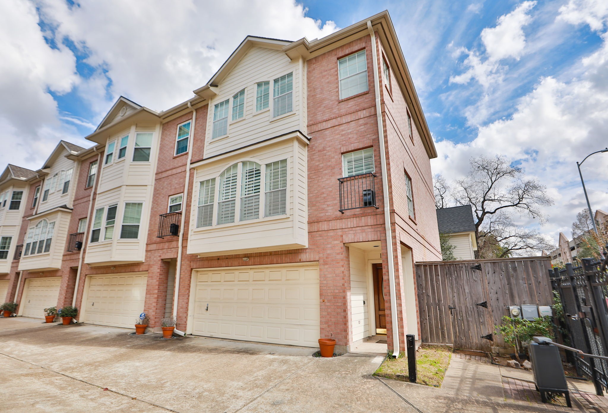 1893 Ewing Street Houston, TX 77004 - Photo 2 of 39 a front view of a building with a garden