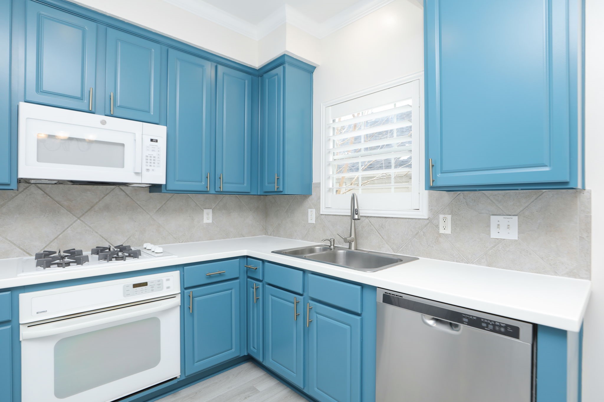 1893 Ewing Street Houston, TX 77004 - Photo 21 of 39 a kitchen with a sink cabinets appliances and a window