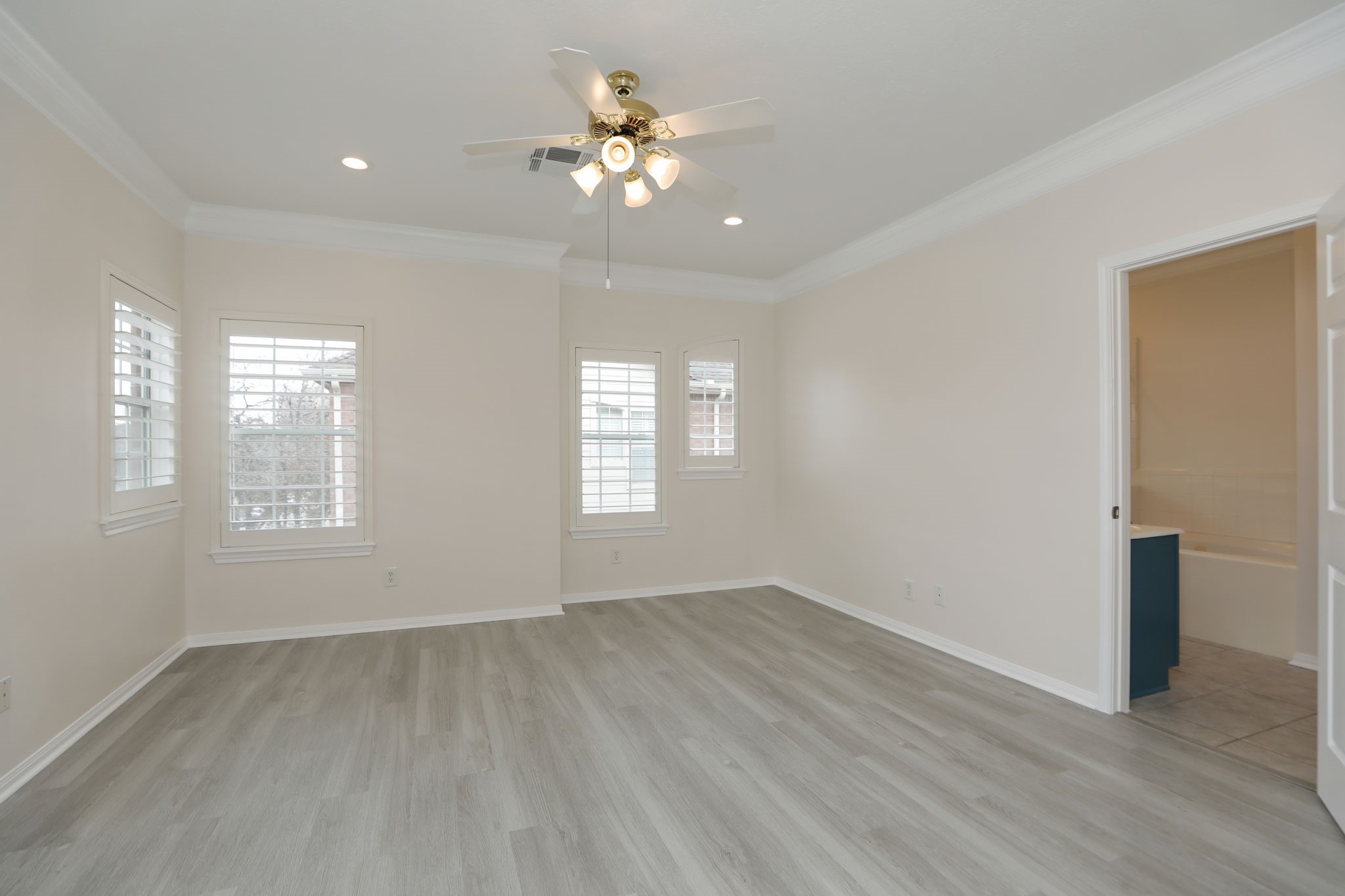 1893 Ewing Street Houston, TX 77004 - Photo 28 of 39 an empty room with wooden floor and windows