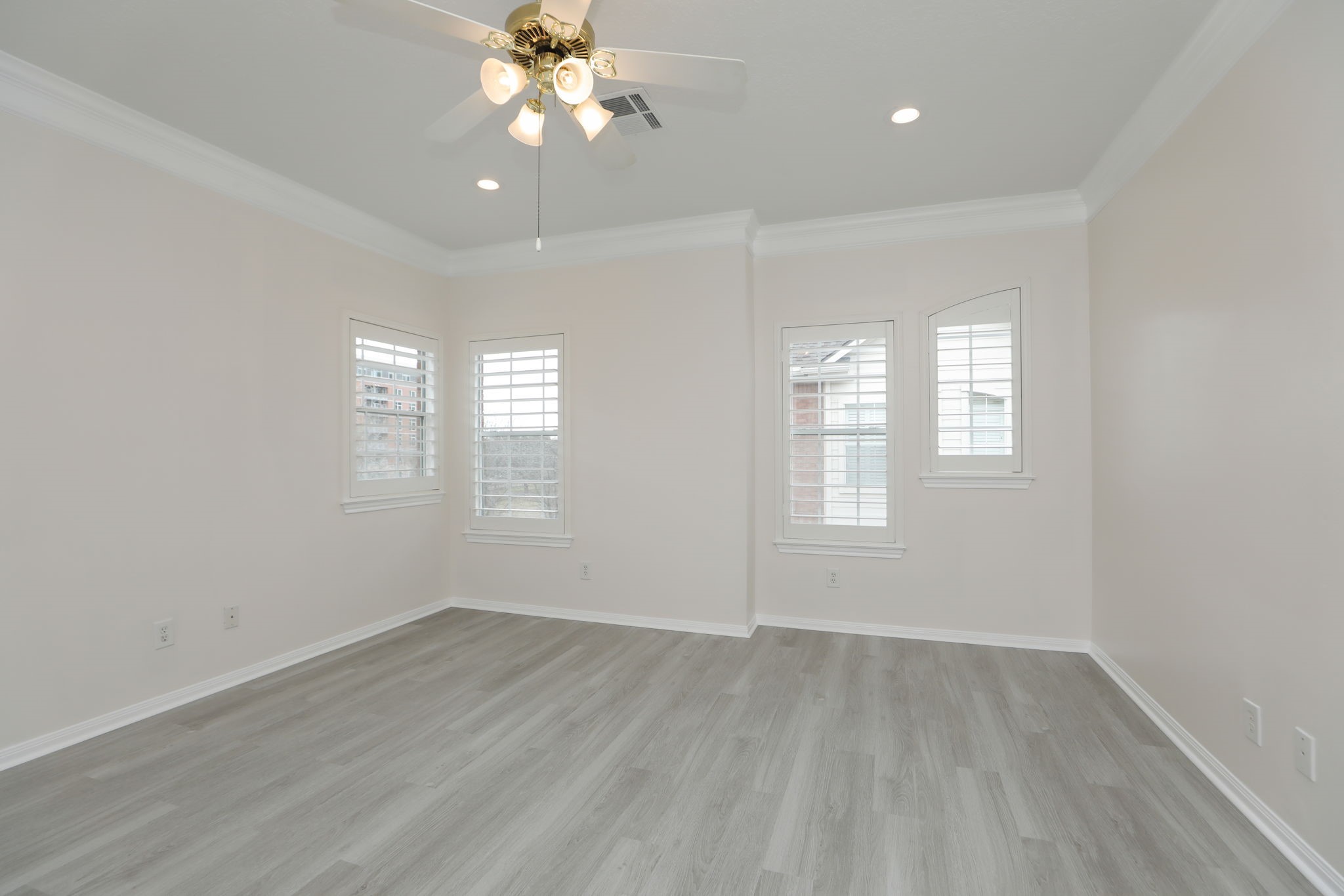 1893 Ewing Street Houston, TX 77004 - Photo 29 of 39 an empty room with wooden floor and windows