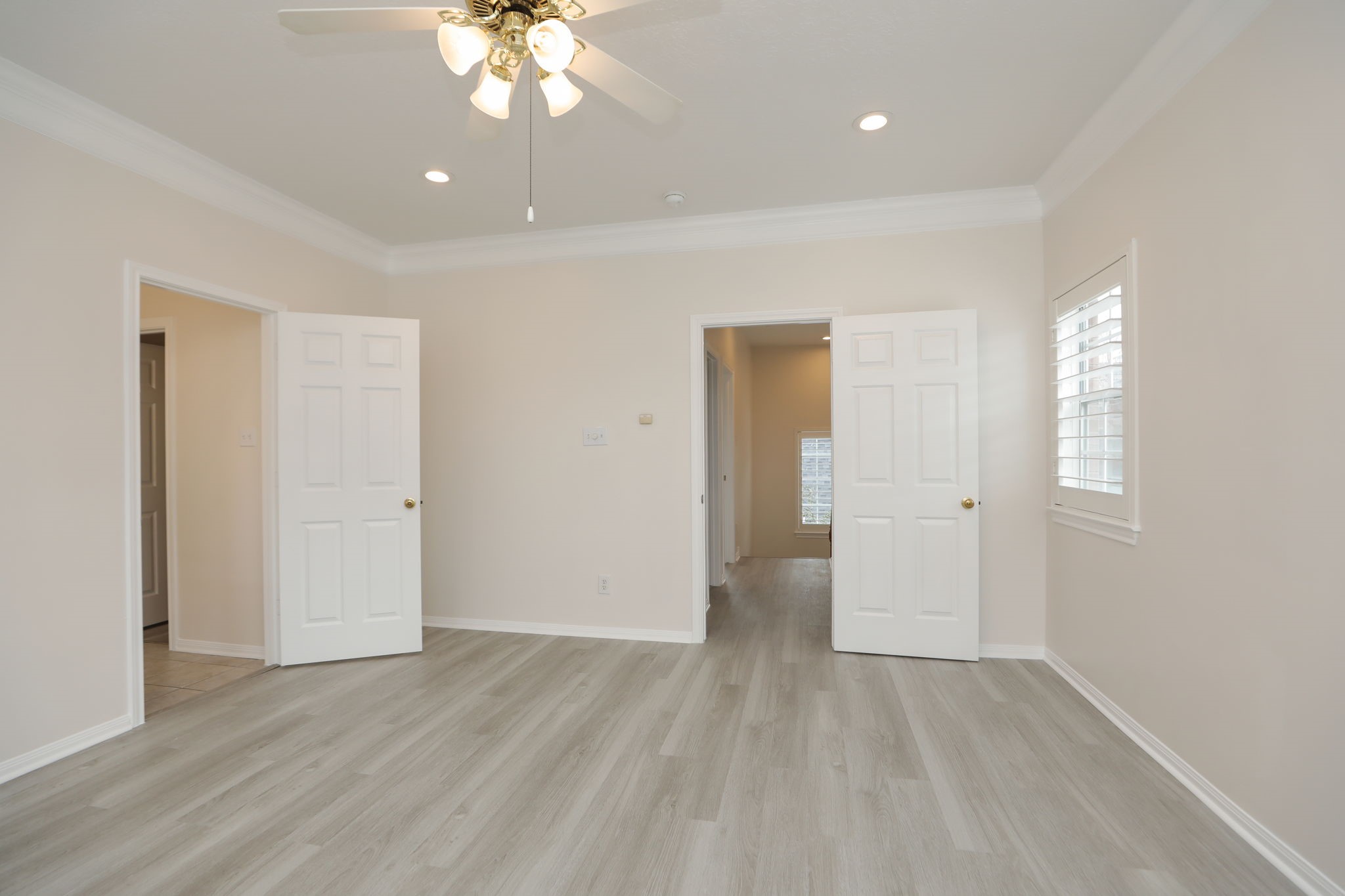 1893 Ewing Street Houston, TX 77004 - Photo 30 of 39 an empty room with wooden floor and windows
