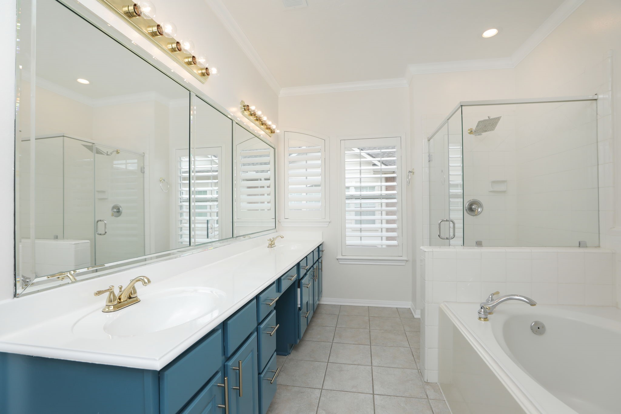 1893 Ewing Street Houston, TX 77004 - Photo 31 of 39 a bathroom with a tub sink and mirror