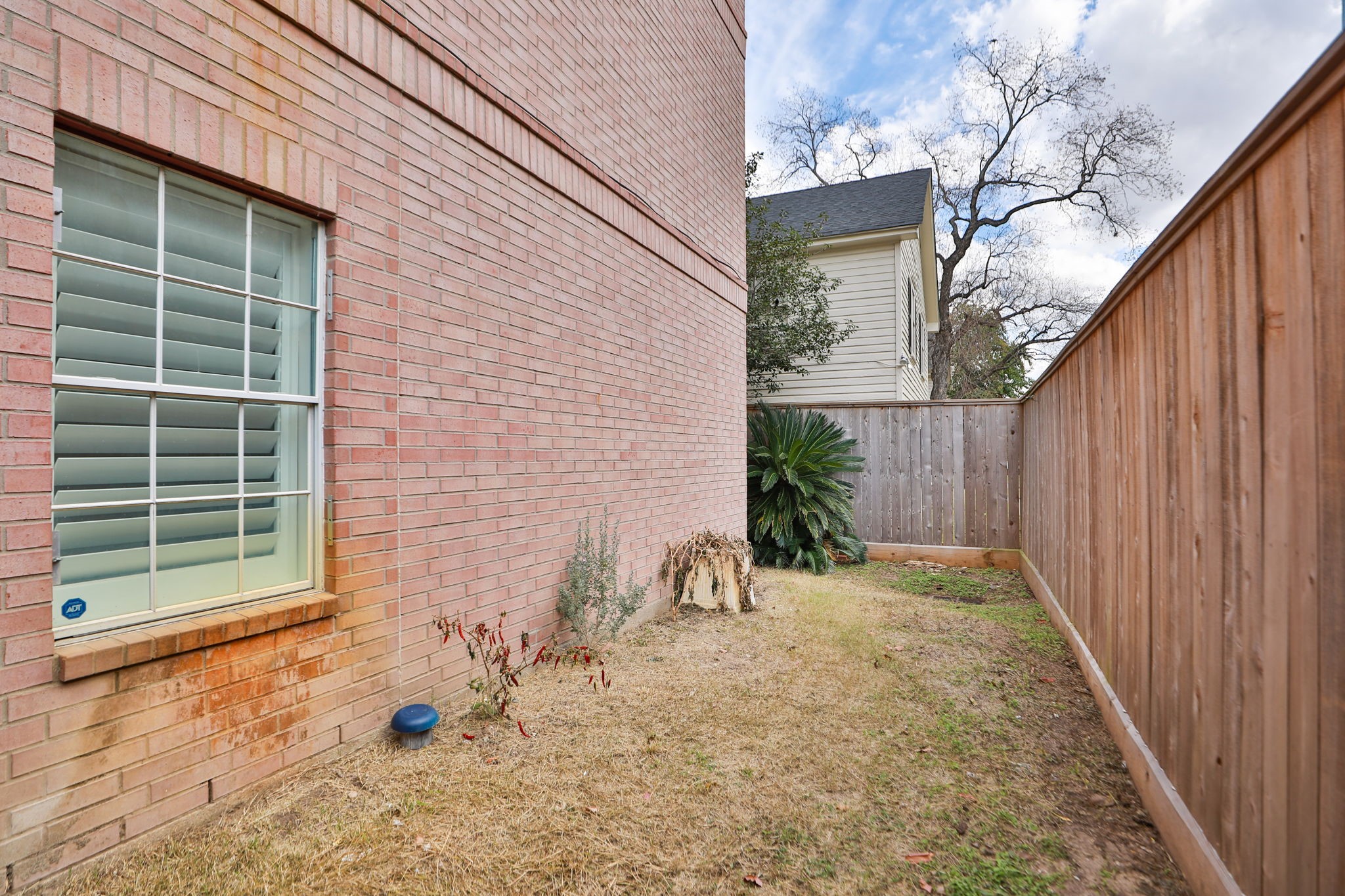 1893 Ewing Street Houston, TX 77004 - Photo 35 of 39 a backyard of a house with table and chairs