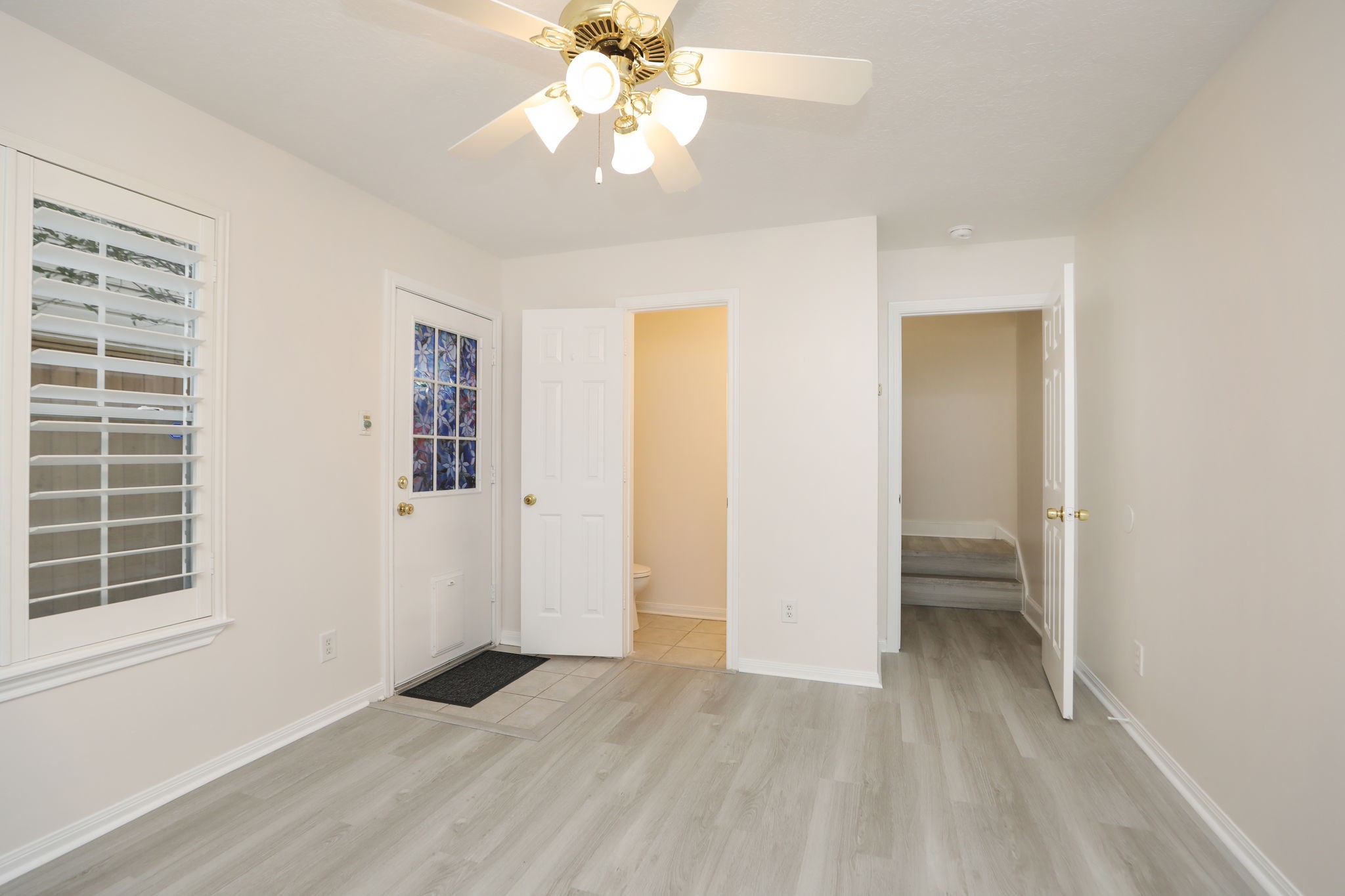 1893 Ewing Street Houston, TX 77004 - Photo 9 of 39 wooden floor in an empty room with a window