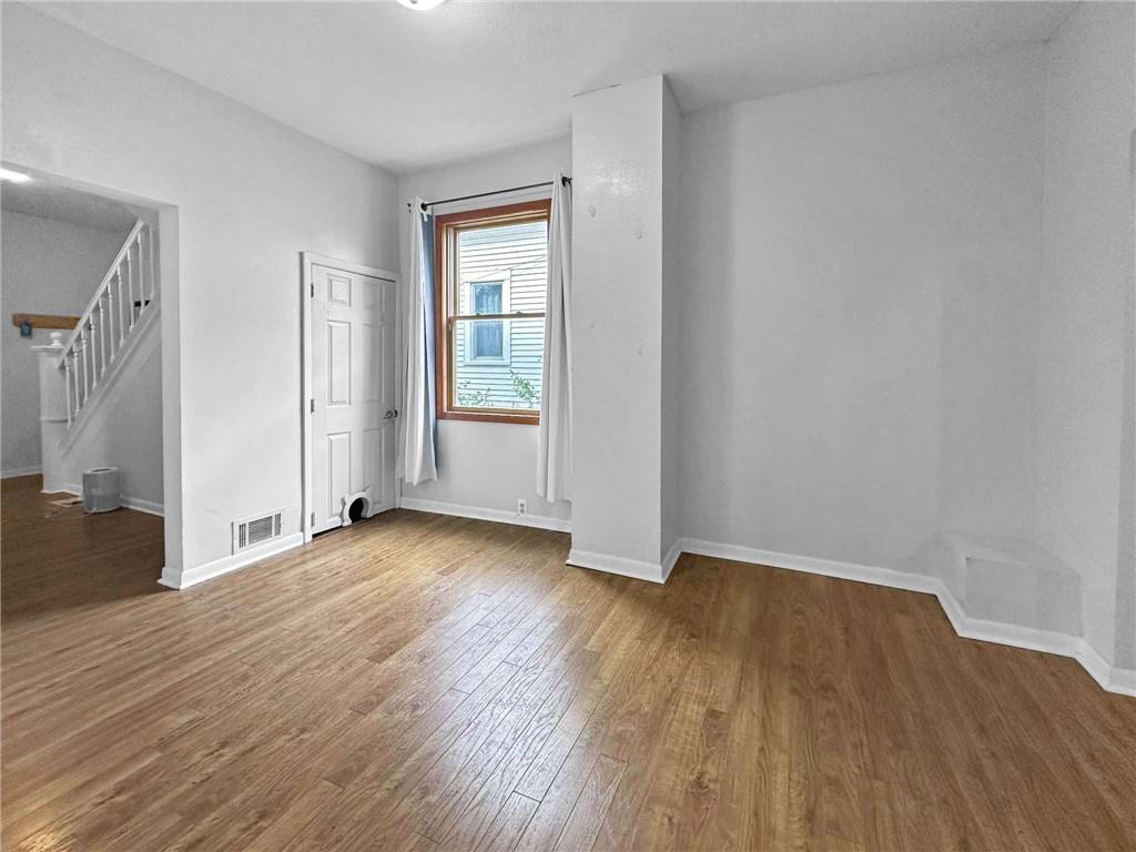 148 Oak Spring Road Canonsburg, PA 15317 - Photo 15 of 34 an empty room with wooden floor and a window