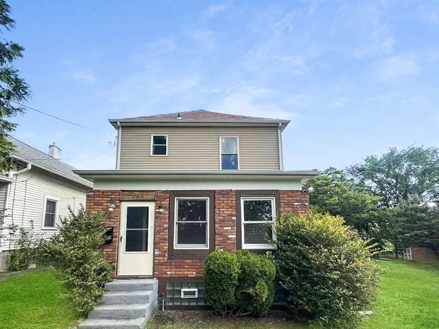 front view of a house with a yard