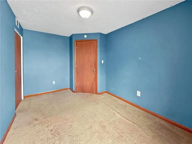 a view of a hallway with windows