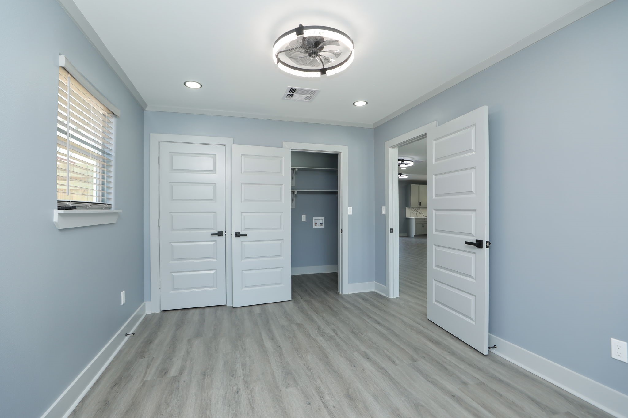 4047 Juliet Street Houston, TX 77087 - Photo 26 of 38 an empty room with closet and wooden door