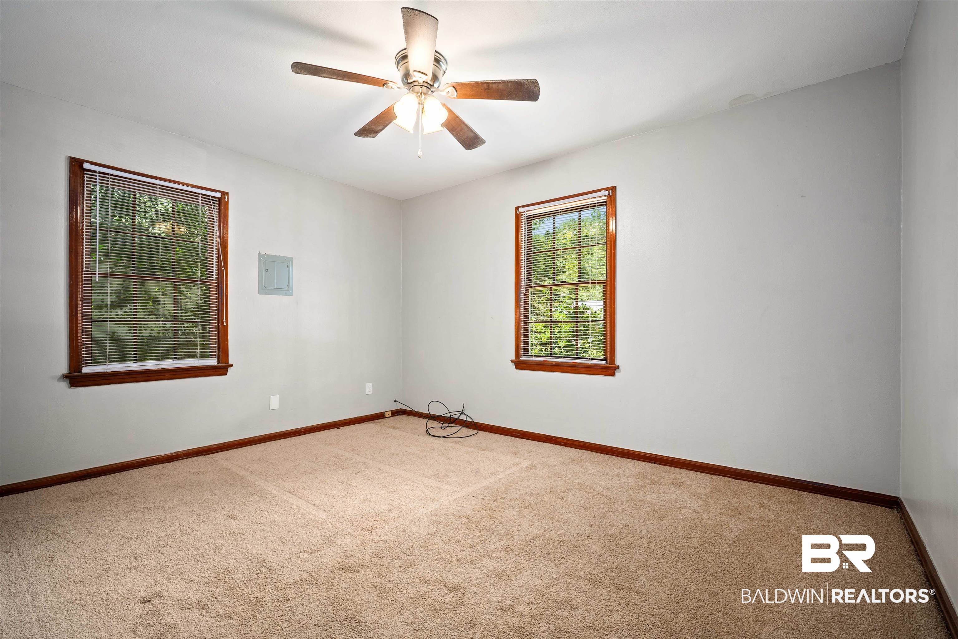 9 Elizabeth Avenue Mobile, AL 36611 - Photo 16 of 19 Carpeted empty room with a ceiling fan and baseboards