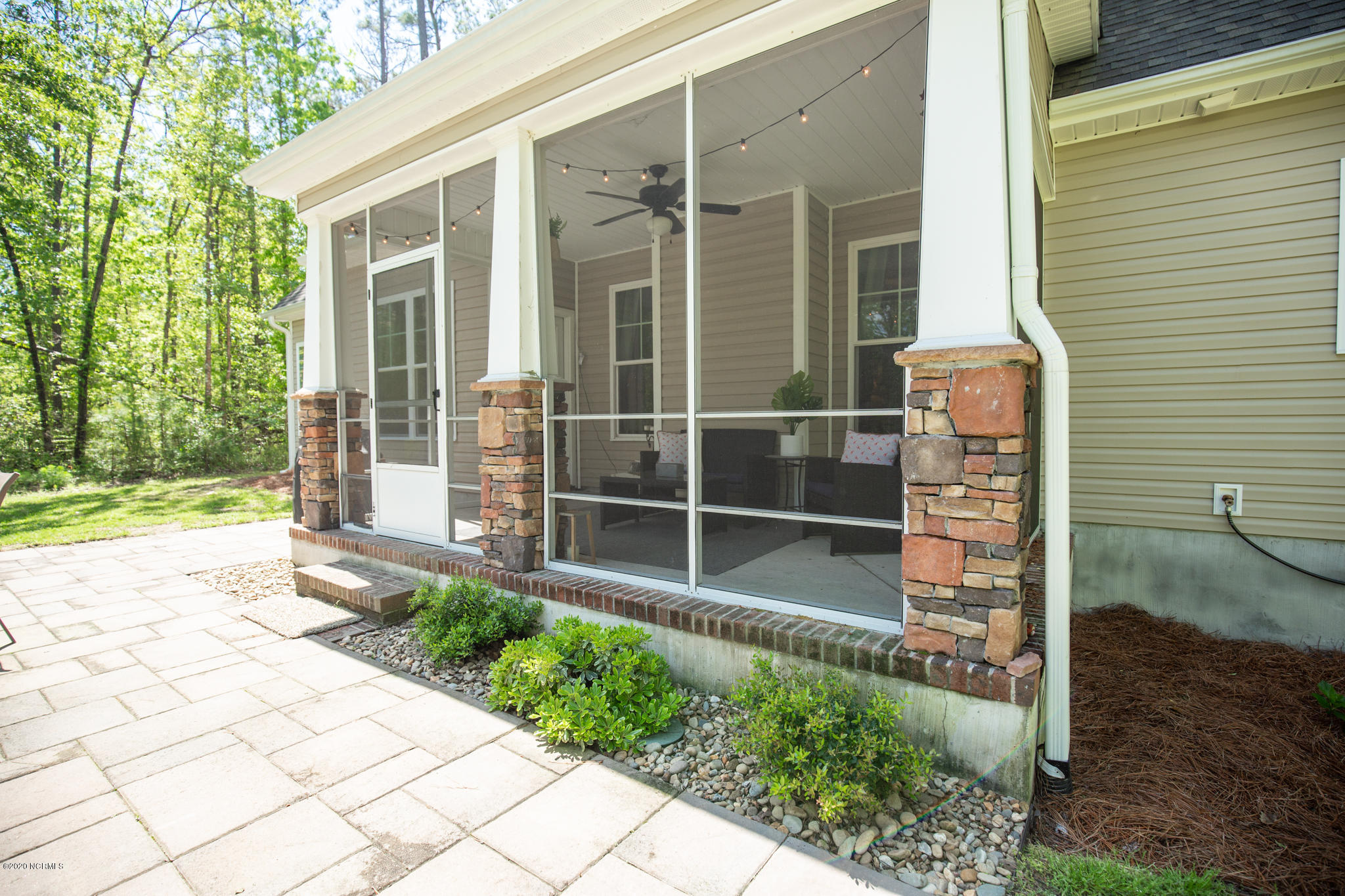 146 Forest Ridge Trail Stella, NC 28582 - Photo 48 of 58 Screened-in patio and stone outside patio