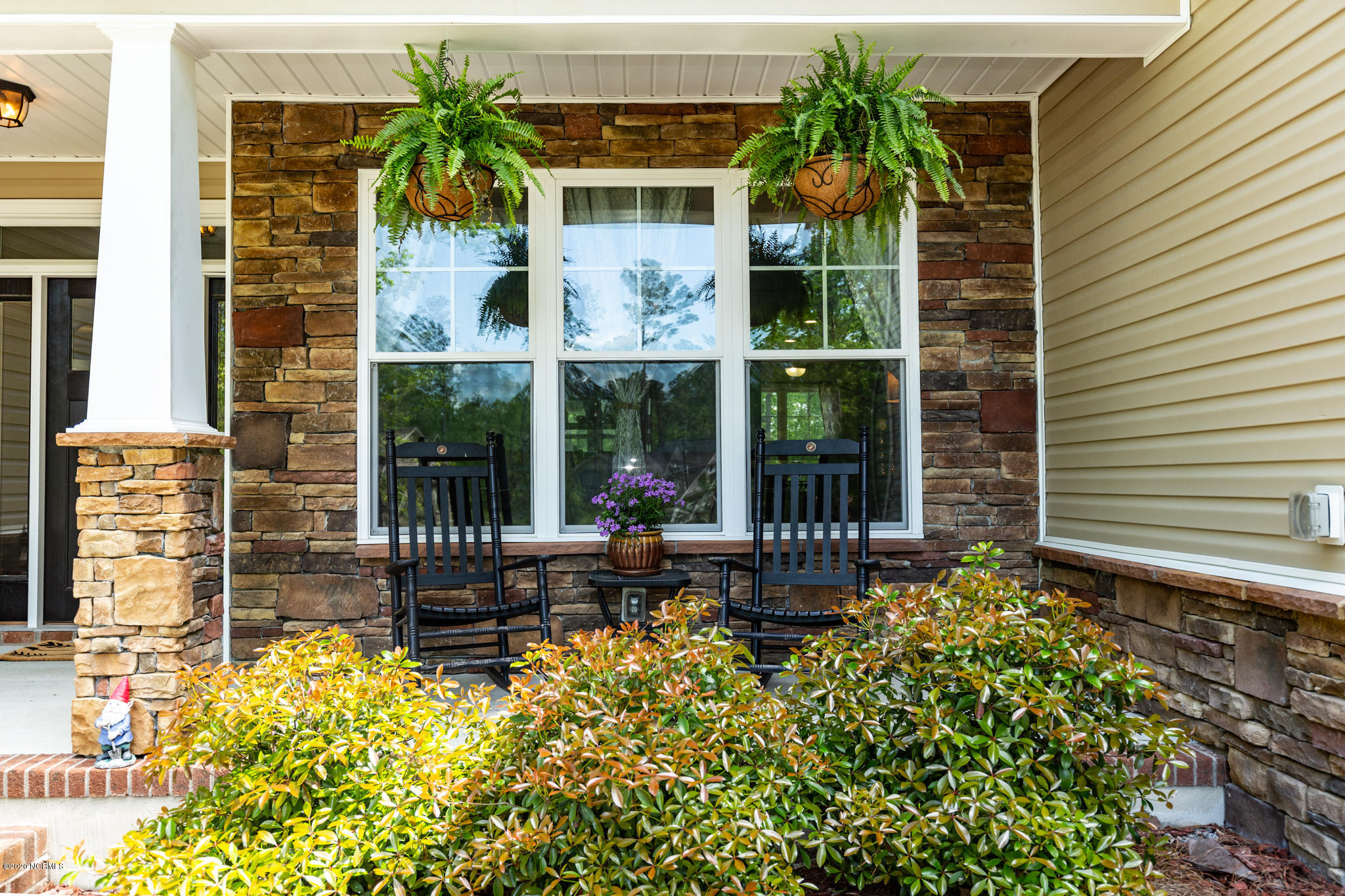 146 Forest Ridge Trail Stella, NC 28582 - Photo 8 of 58 Beautiful stone facade around your covered front rocking porch