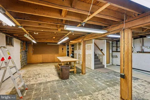 a view of a patio with table and chairs with wooden floor and fence