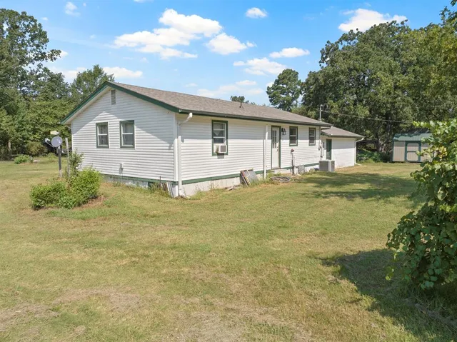 a house view with a garden space