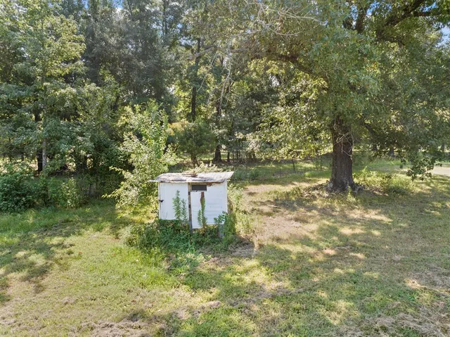 a view of outdoor space with deck and yard