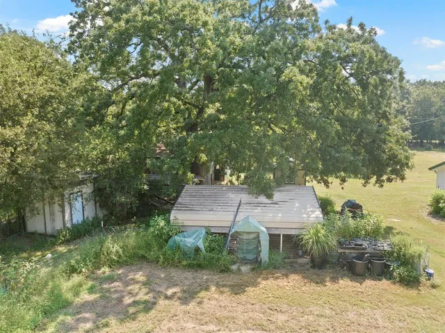 a view of a yard with an trees