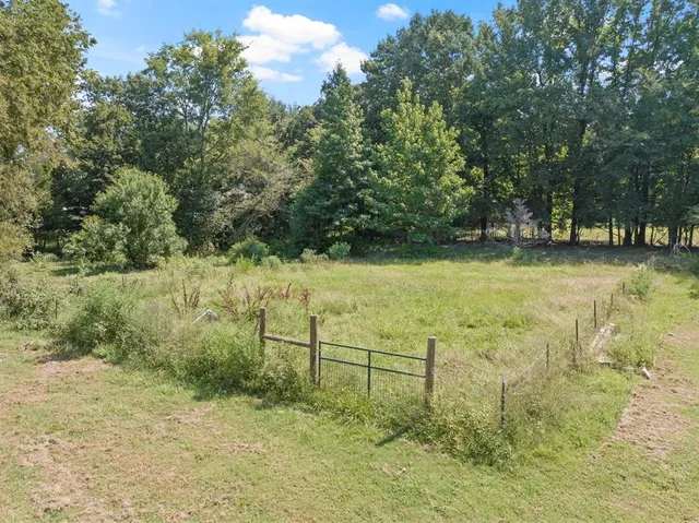 a view of outdoor space with trees all around