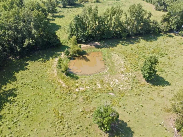 an aerial view of residential house and outdoor space