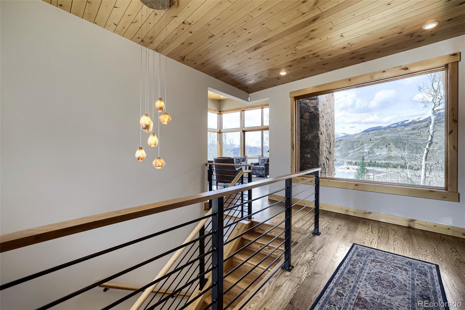 836 Maryland Creek Road Silverthorne, CO 80498 - Photo 6 of 49 a view of a room with wooden floor and windows