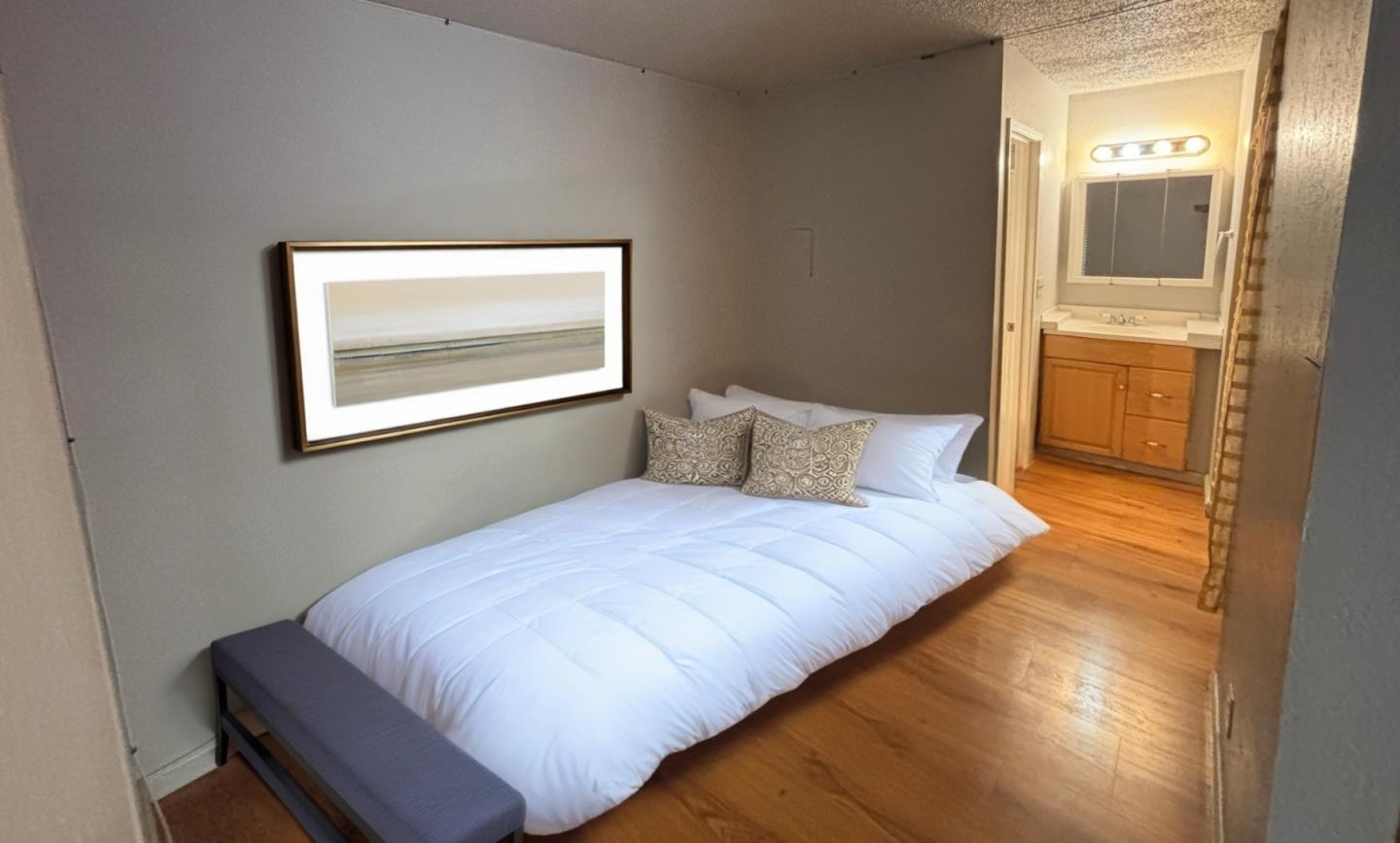 934 Kiely Boulevard, Unit B Santa Clara, CA 95051 - Photo 11 of 19 a bedroom with a bed and painting on the wall